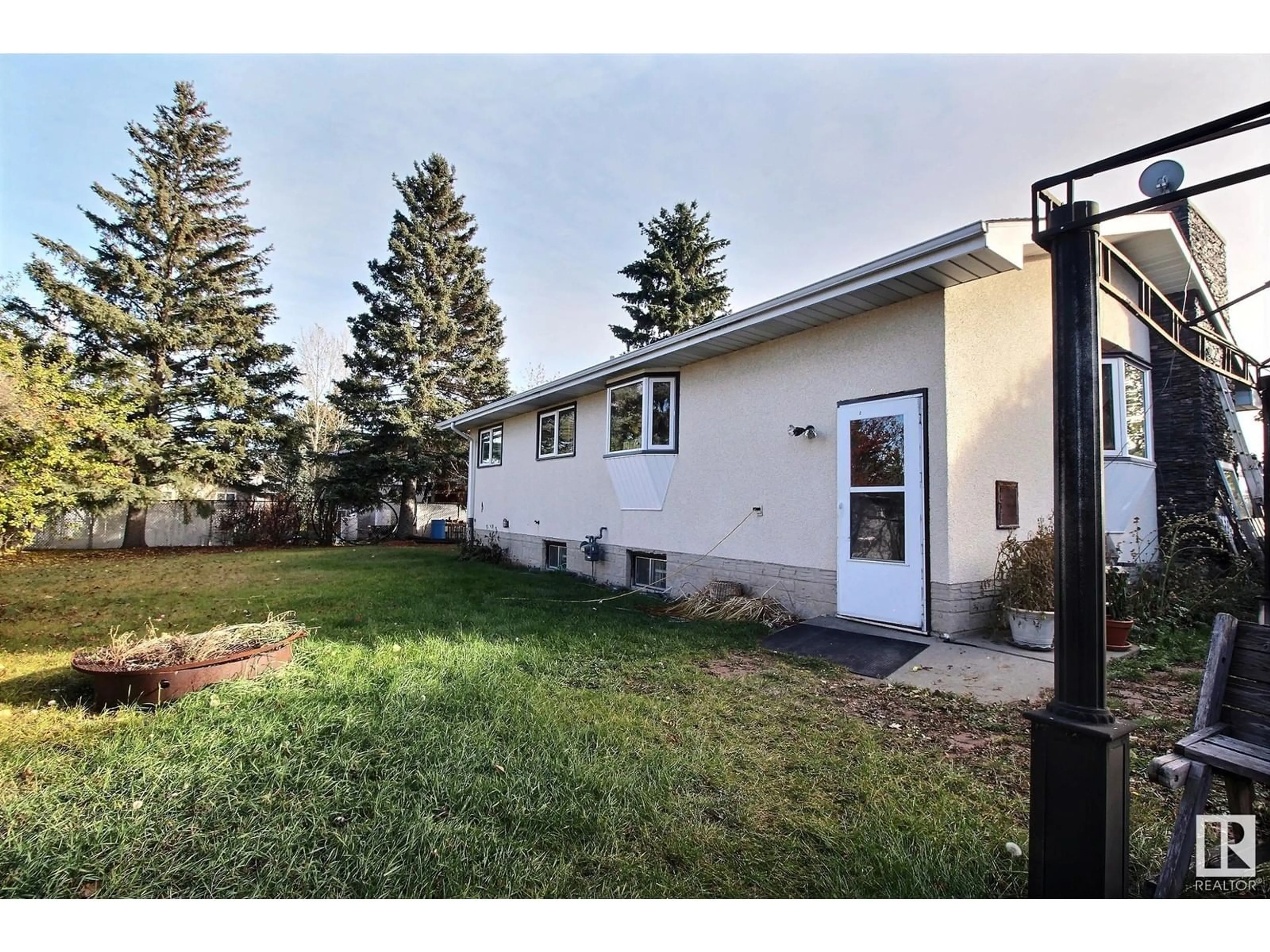 Frontside or backside of a home, the fenced backyard for 319 LEE RIDGE RD NW, Edmonton Alberta T6K0N5