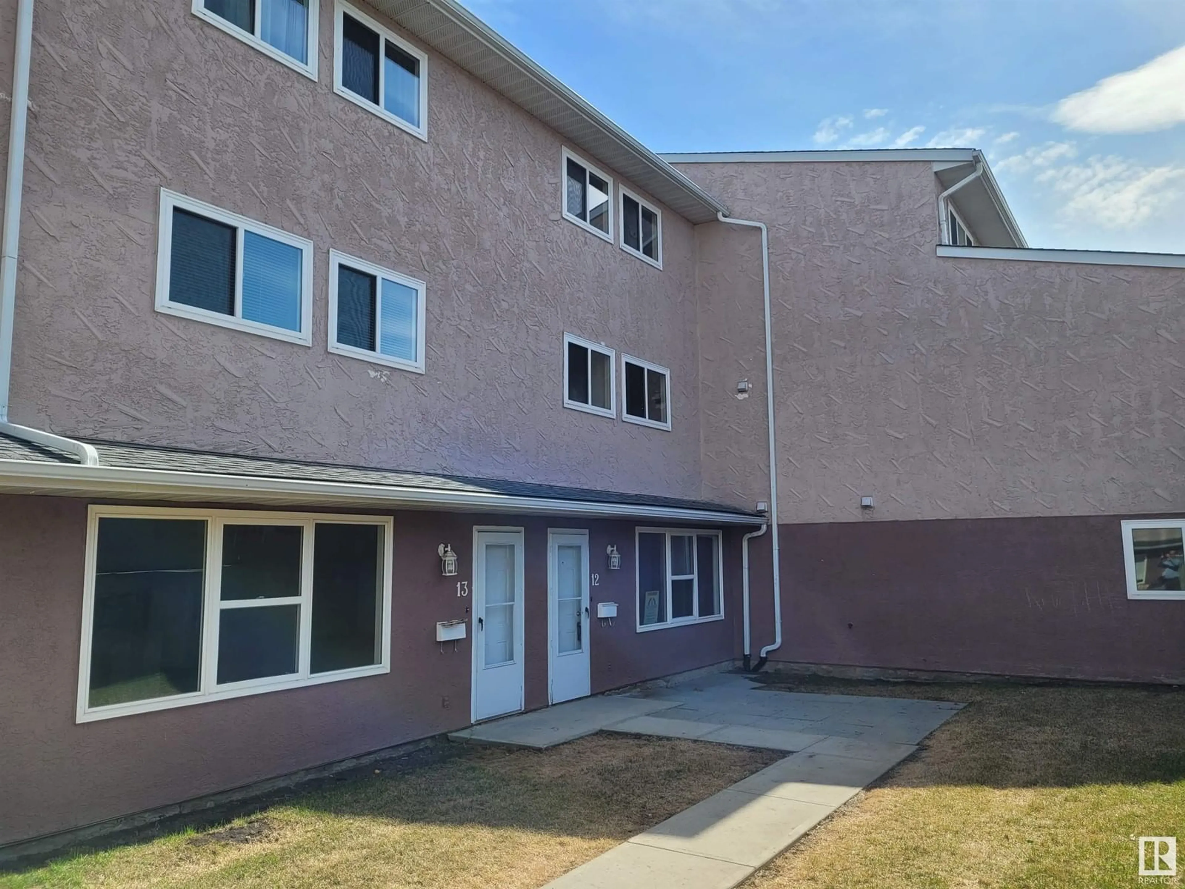 A pic from exterior of the house or condo, the front or back of building for #12 13570 38 ST NW, Edmonton Alberta T5A2W7