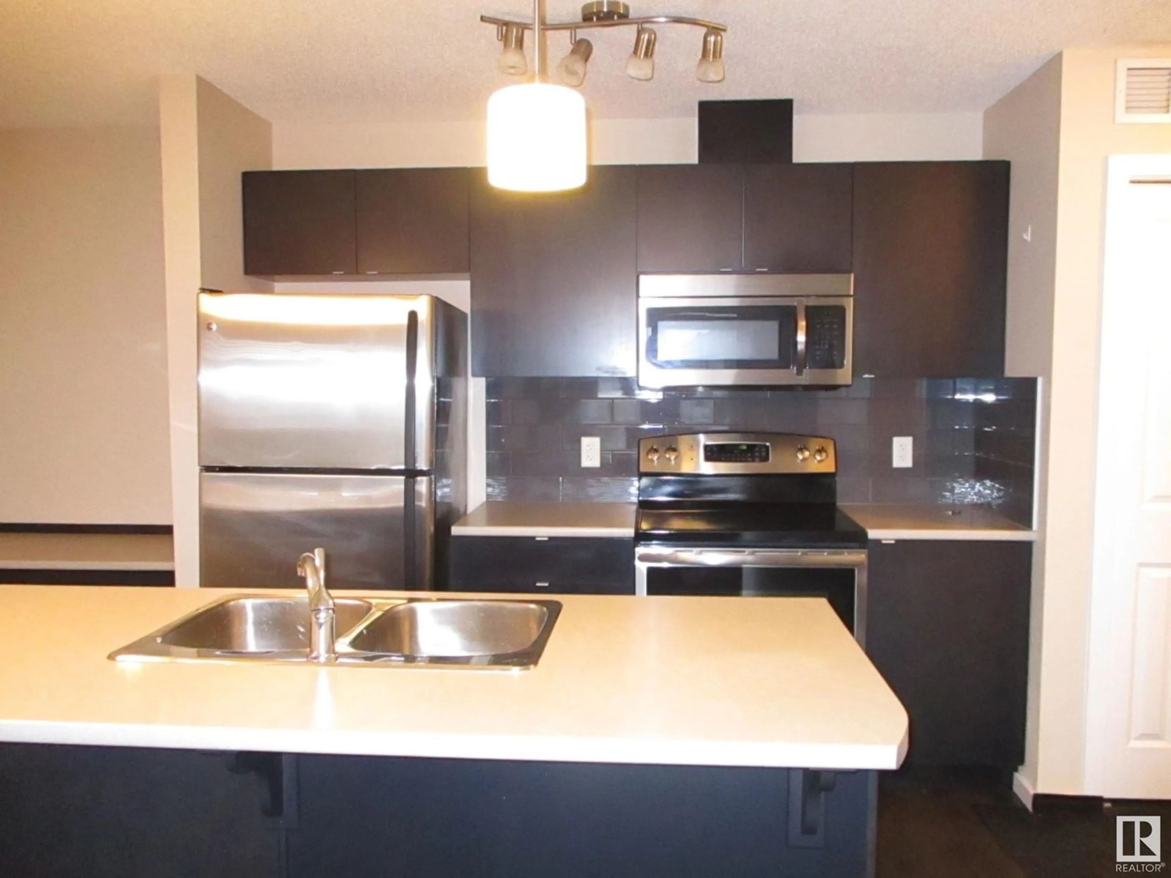 Open concept kitchen for #401 508 Albany WY NW NW, Edmonton Alberta T6V0L1