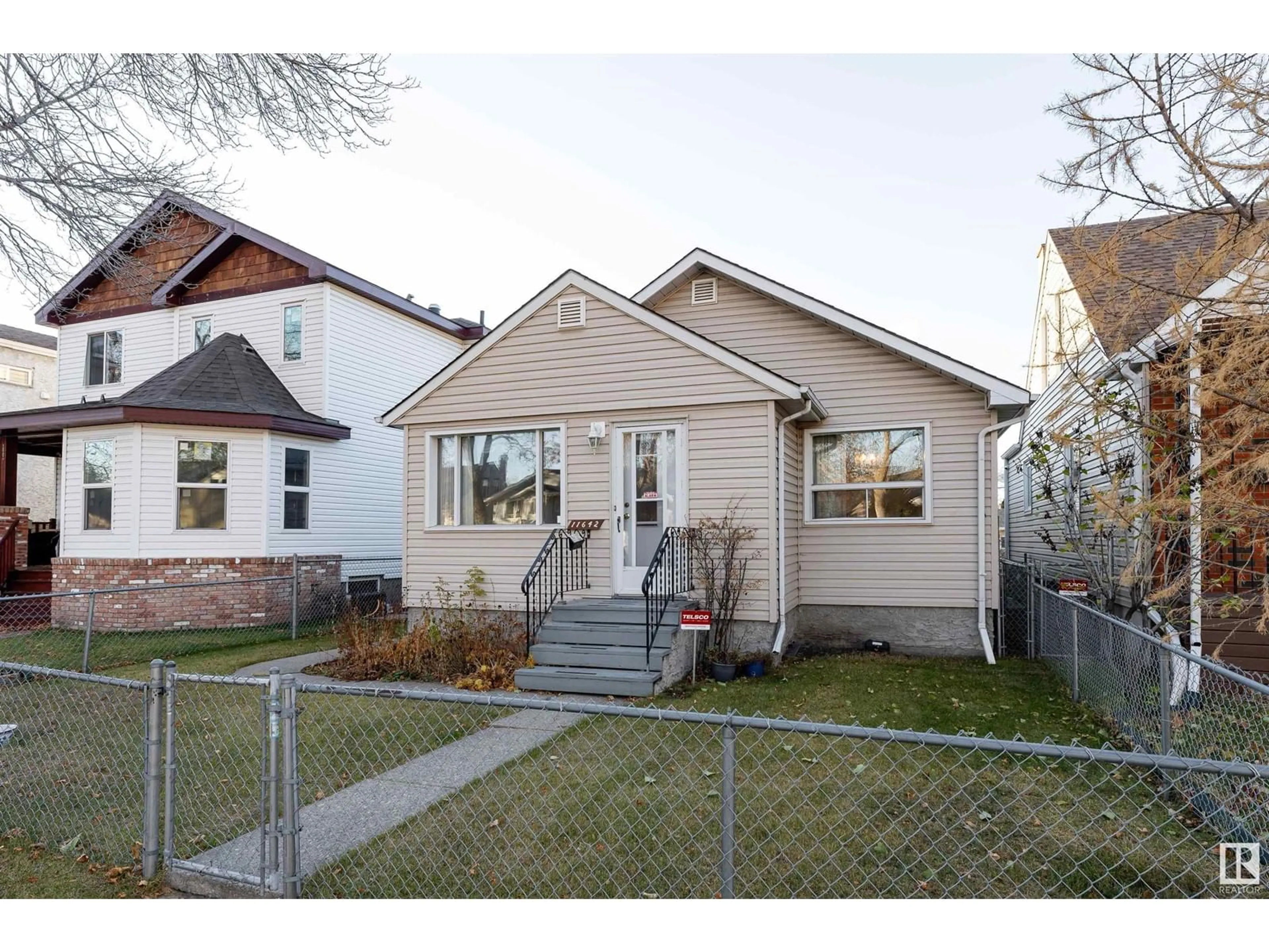 Frontside or backside of a home, the fenced backyard for 11642 87 ST NW, Edmonton Alberta T5B3M5