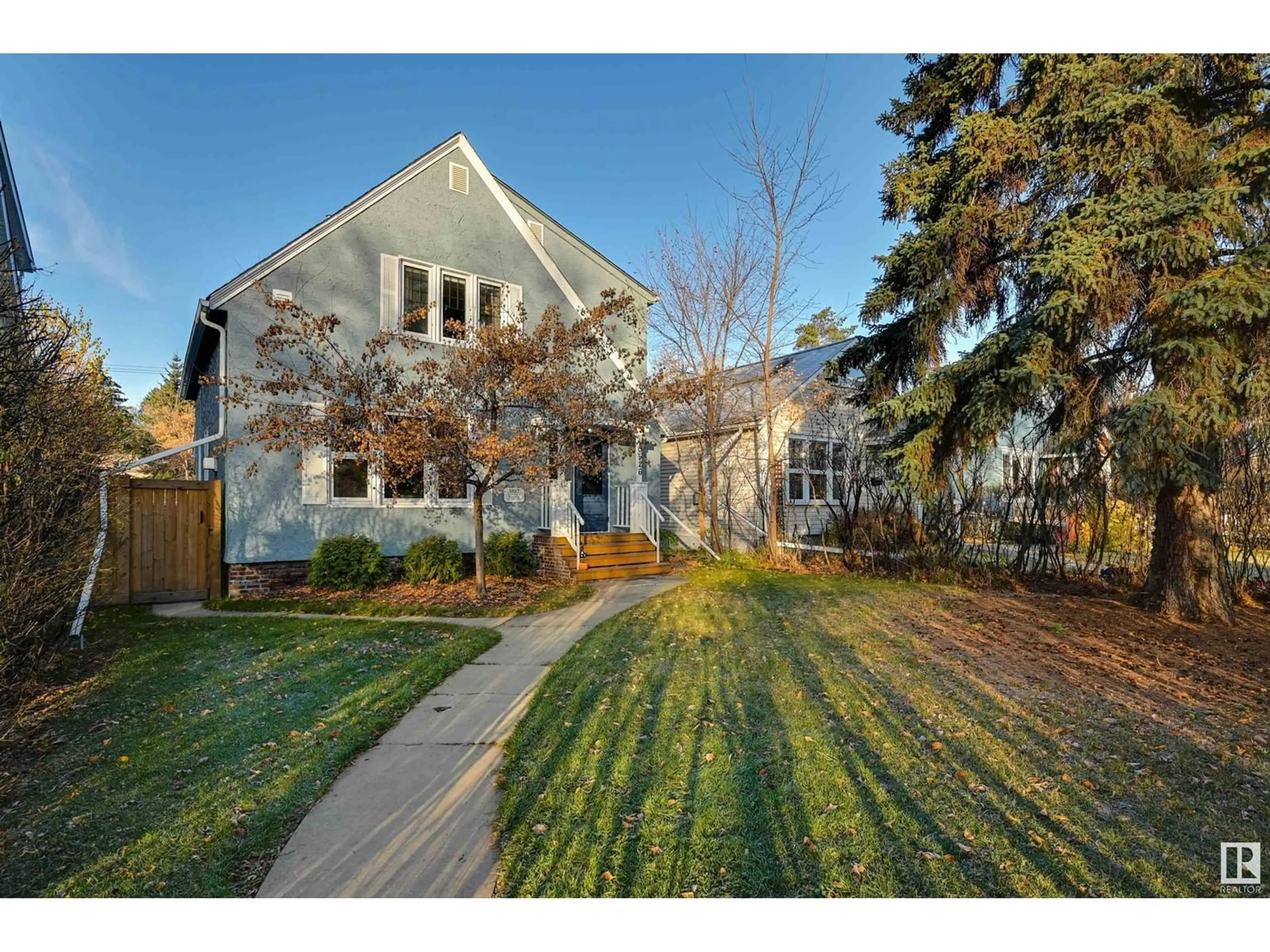 Frontside or backside of a home, the fenced backyard for 10526 127 ST NW, Edmonton Alberta T5N1V9