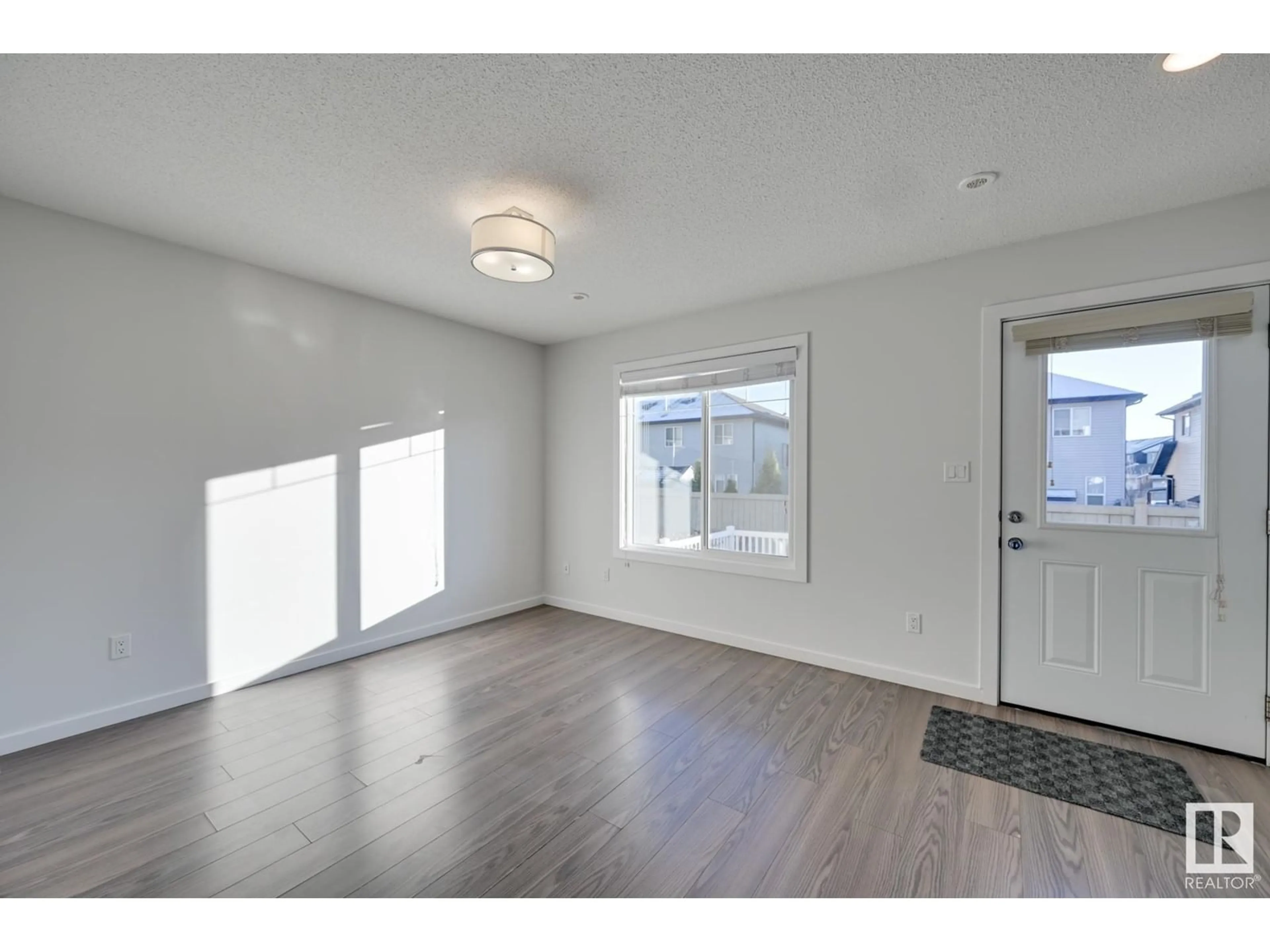 Indoor entryway, wood floors for #7 2215 24 ST NW, Edmonton Alberta T6T1A6