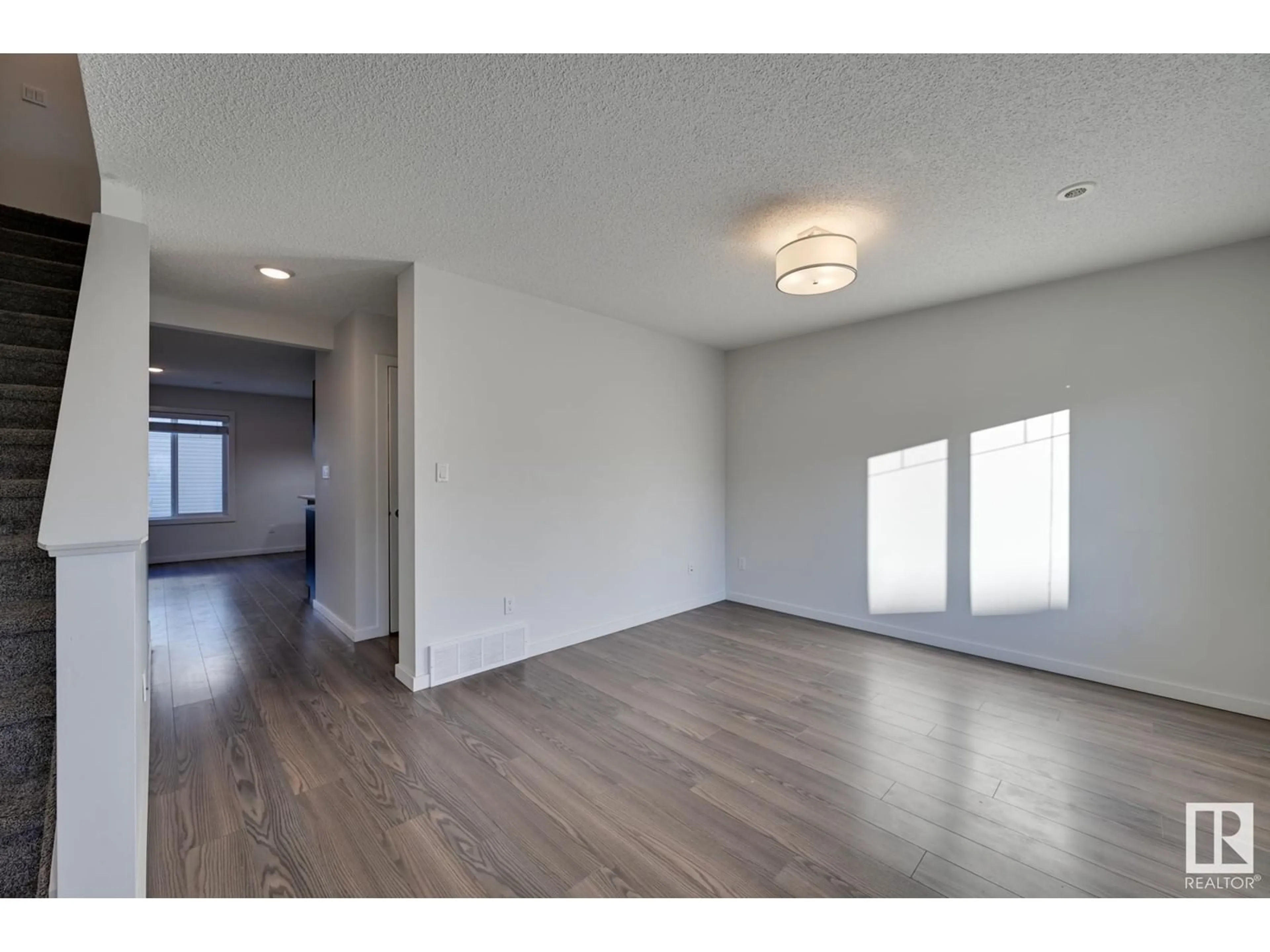 A pic of a room, wood floors for #24 2215 24 ST NW, Edmonton Alberta T6T1A6