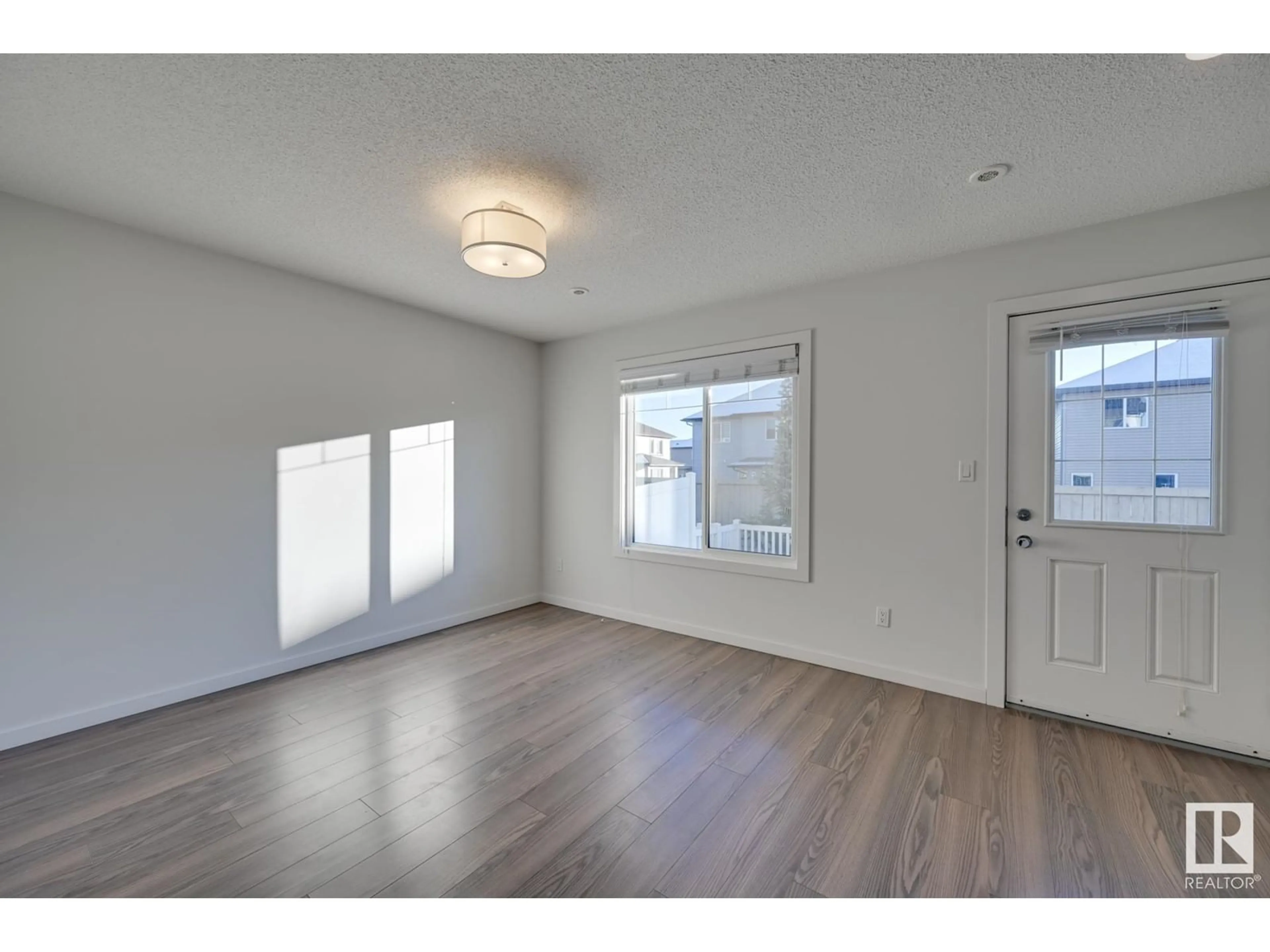 A pic of a room, wood floors for #24 2215 24 ST NW, Edmonton Alberta T6T1A6