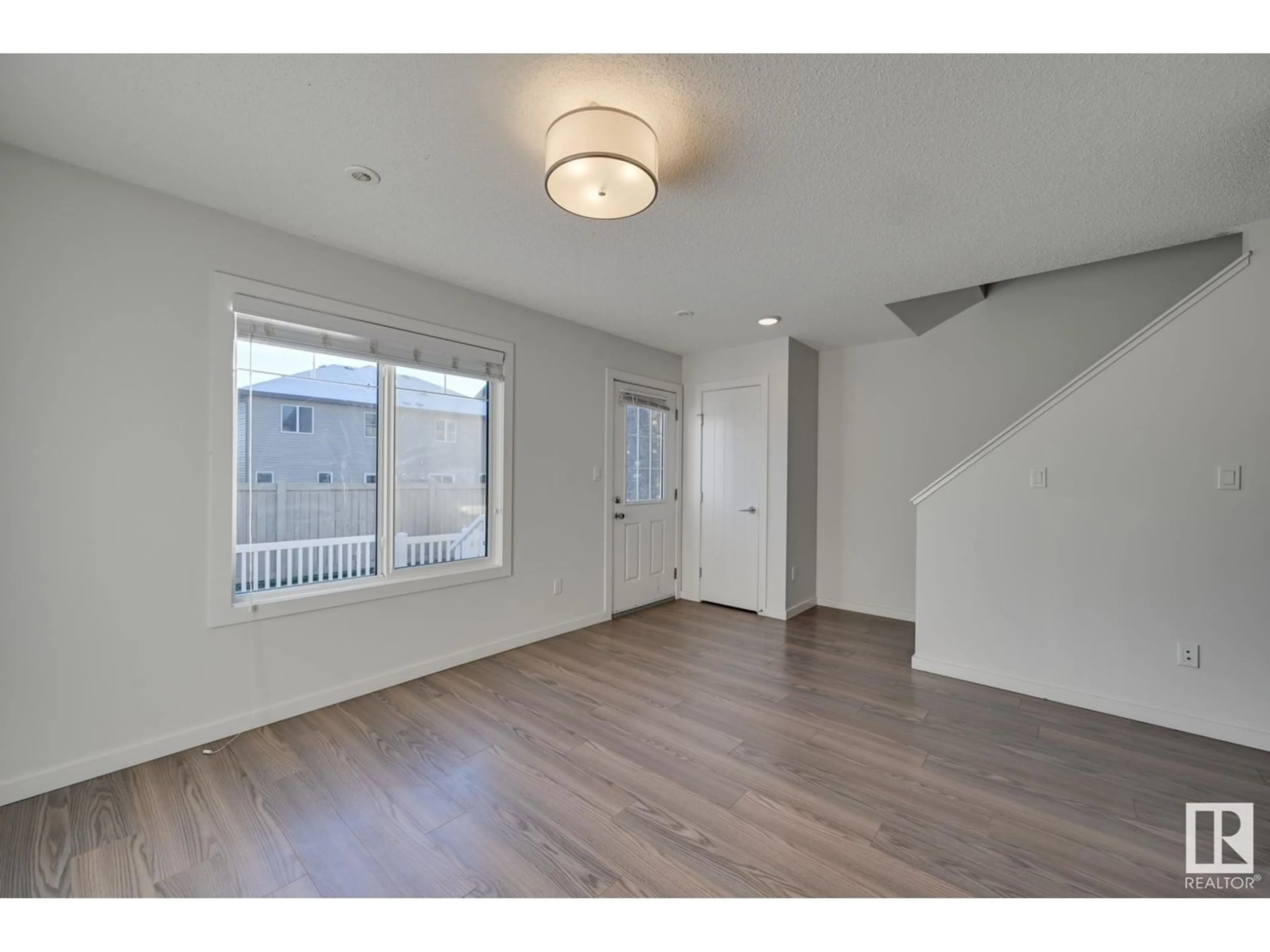 A pic of a room, wood floors for #24 2215 24 ST NW, Edmonton Alberta T6T1A6