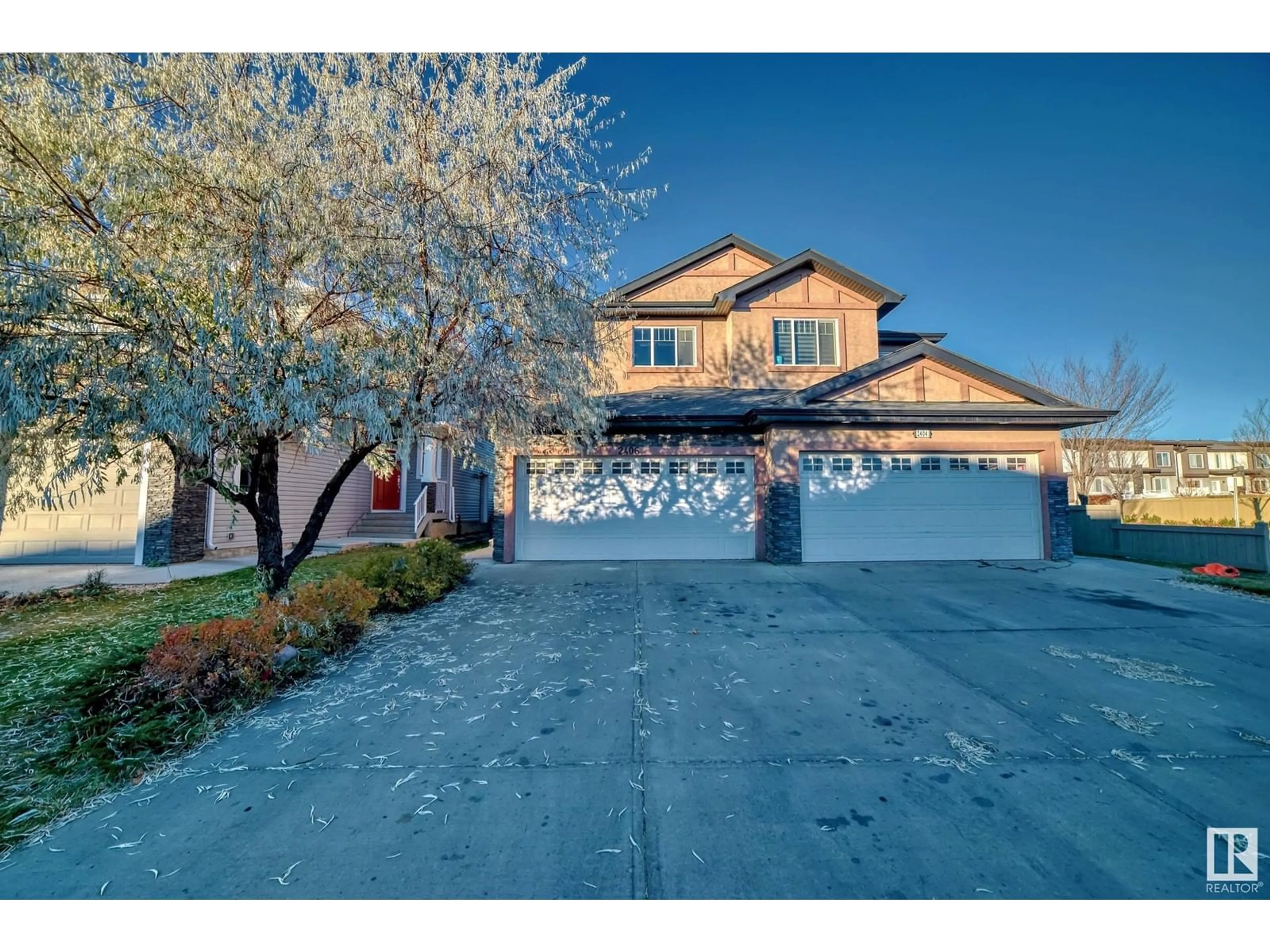 Frontside or backside of a home, the street view for 2406 22 AV NW, Edmonton Alberta T6T0Y4