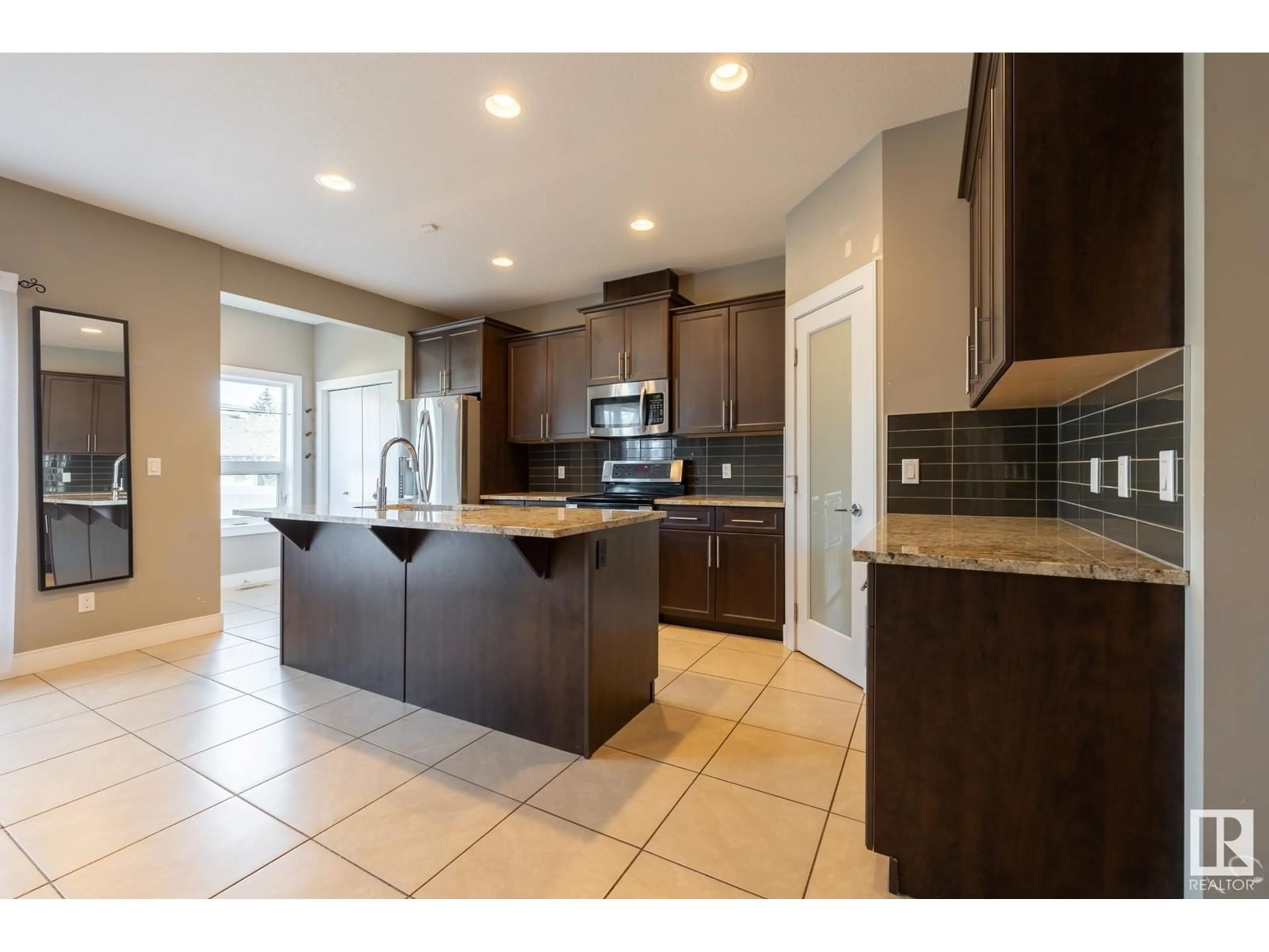 Open concept kitchen for 12221 102 ST NW, Edmonton Alberta T5G2H2