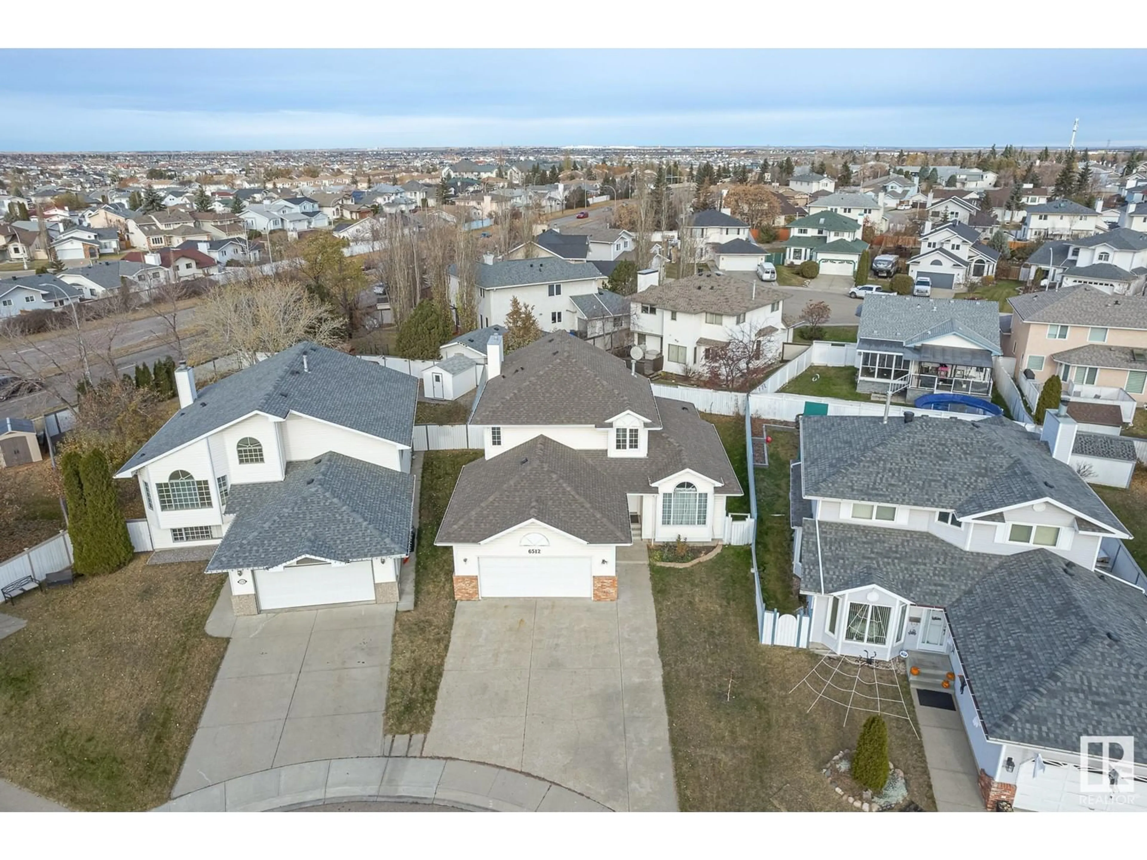 Frontside or backside of a home, the street view for 6512 154 AV NW, Edmonton Alberta T5Y2N7