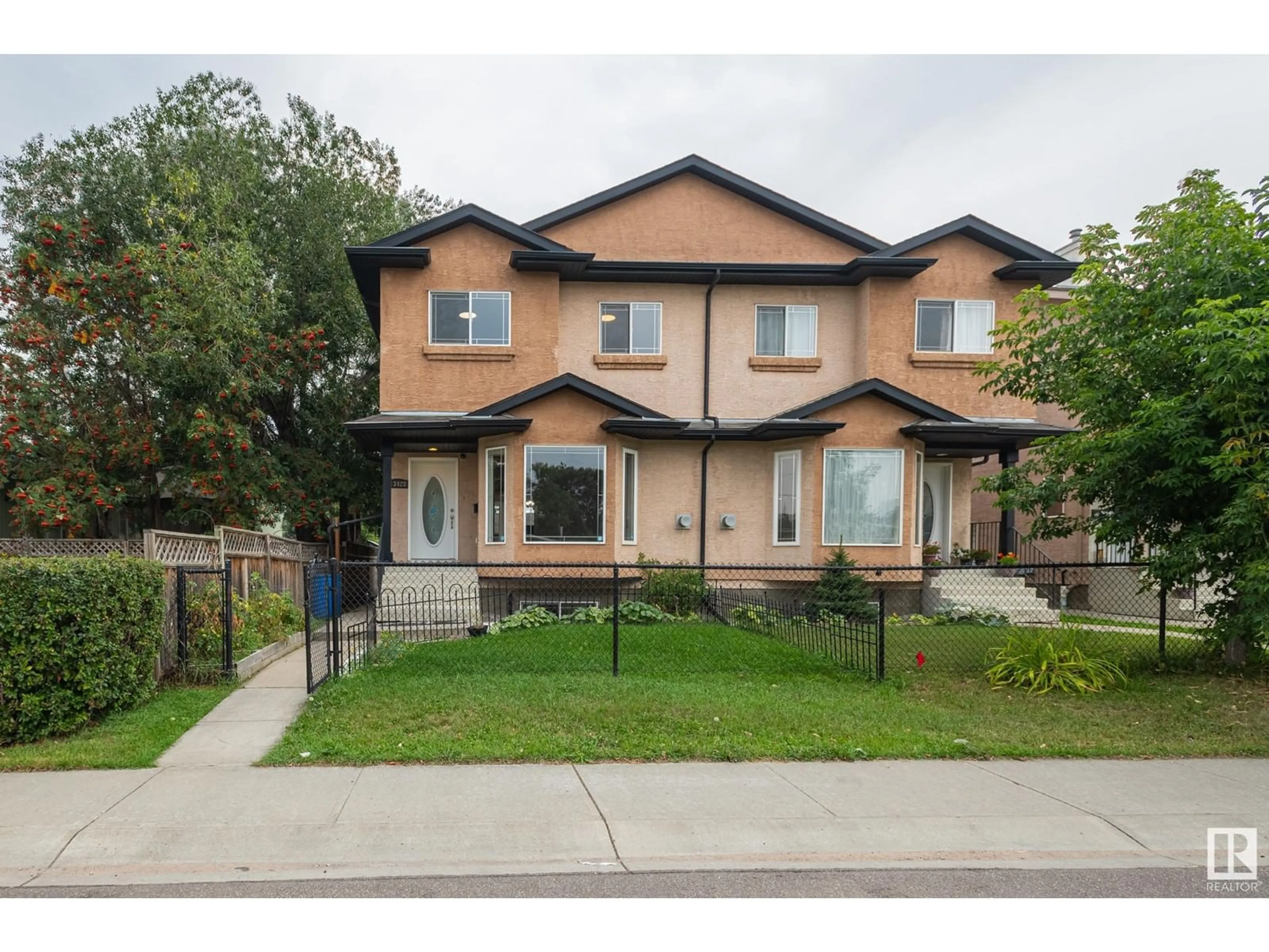 A pic from exterior of the house or condo, the street view for 13428 118 AV NW, Edmonton Alberta T5L2L8