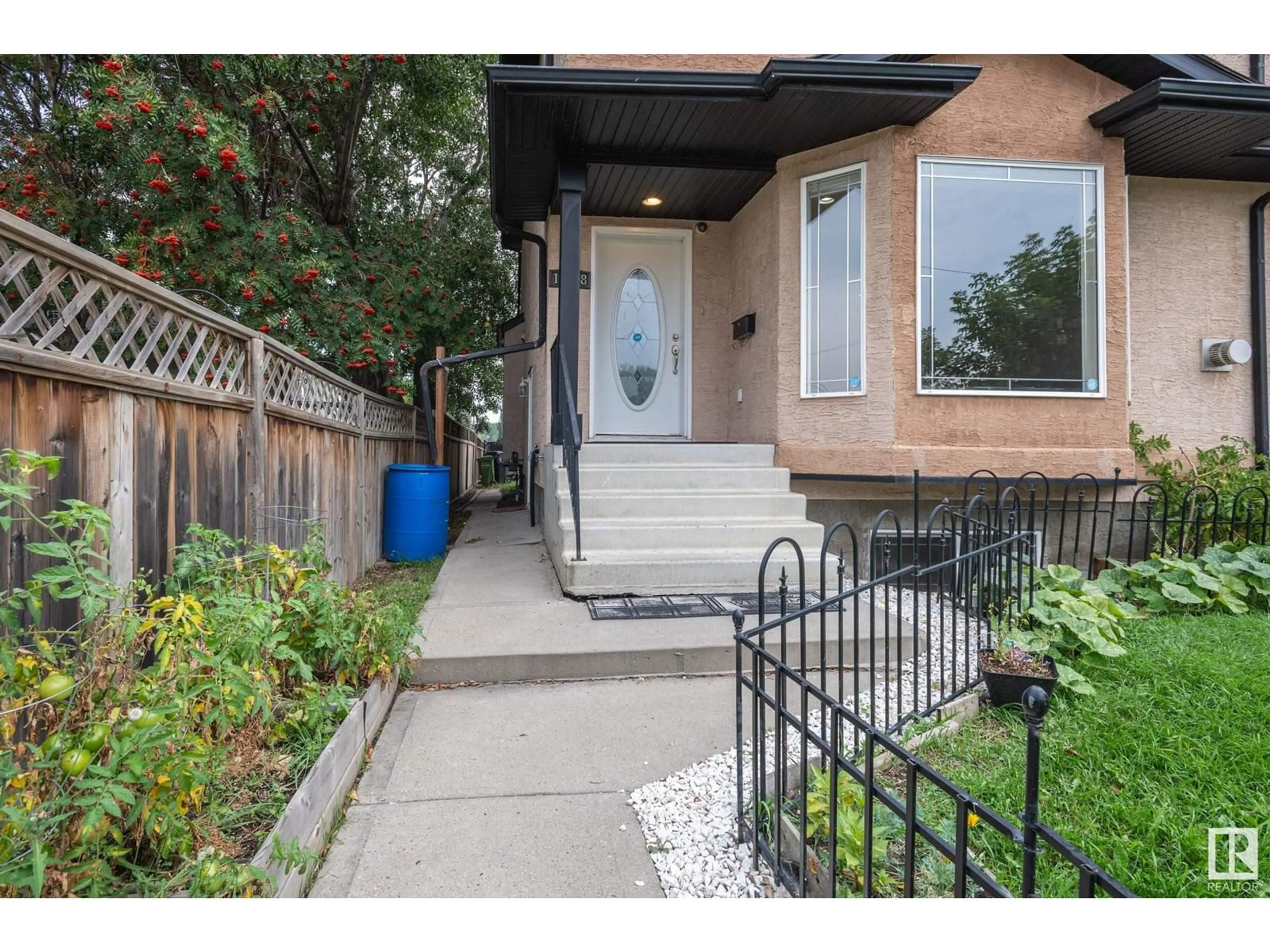 A pic from exterior of the house or condo, the street view for 13428 118 AV NW, Edmonton Alberta T5L2L8