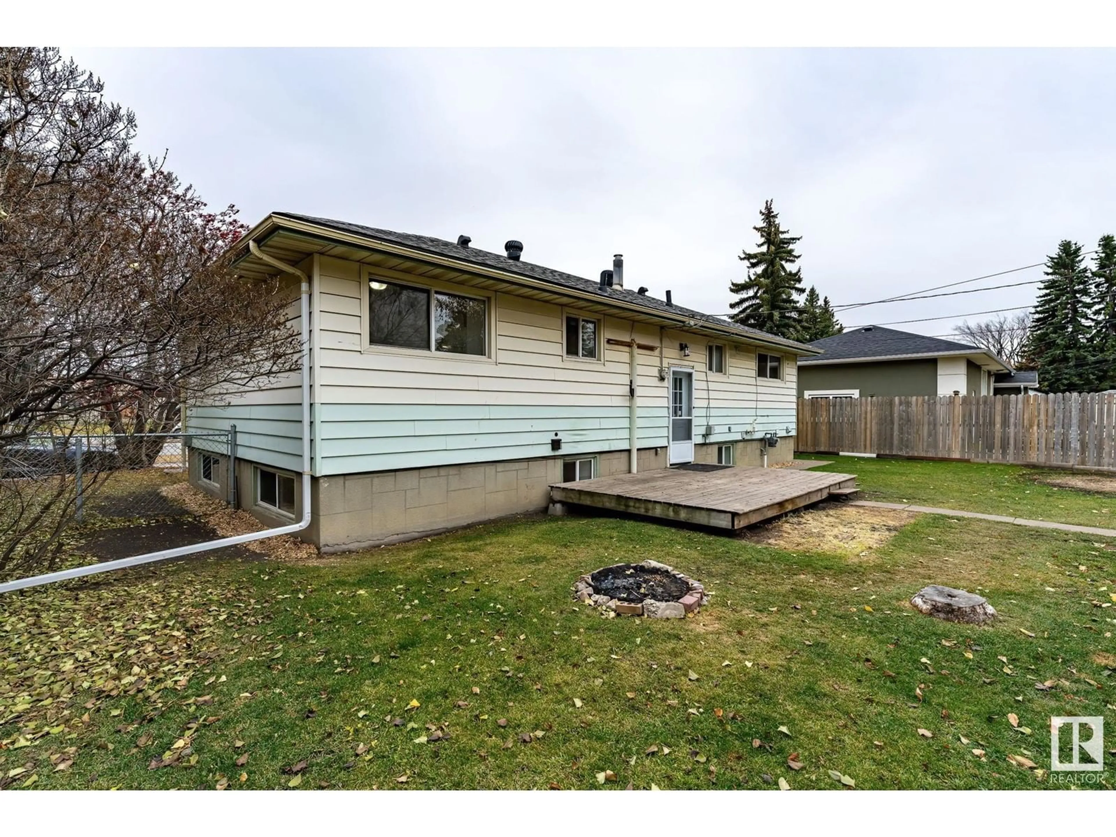 Frontside or backside of a home, the fenced backyard for 9422 75 ST NW, Edmonton Alberta T6C2H7