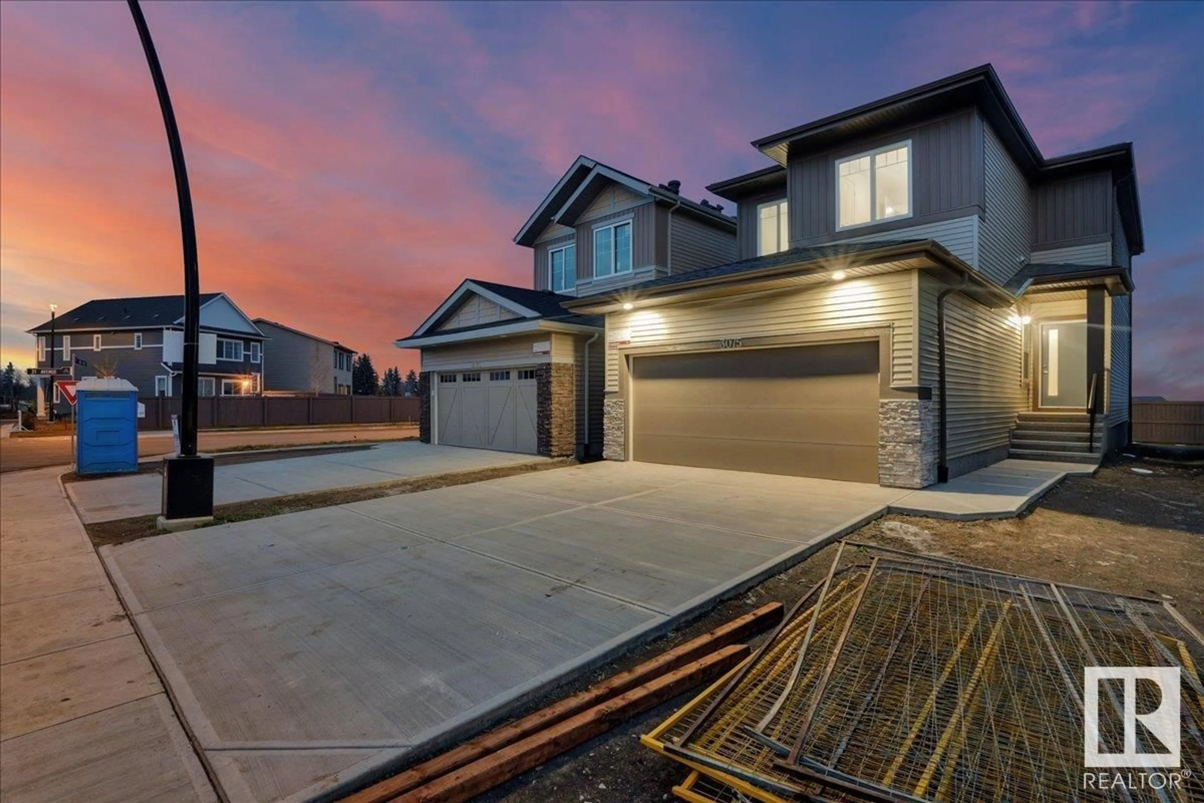 Frontside or backside of a home, the fenced backyard for 3075 200 ST NW, Edmonton Alberta T6M1N7