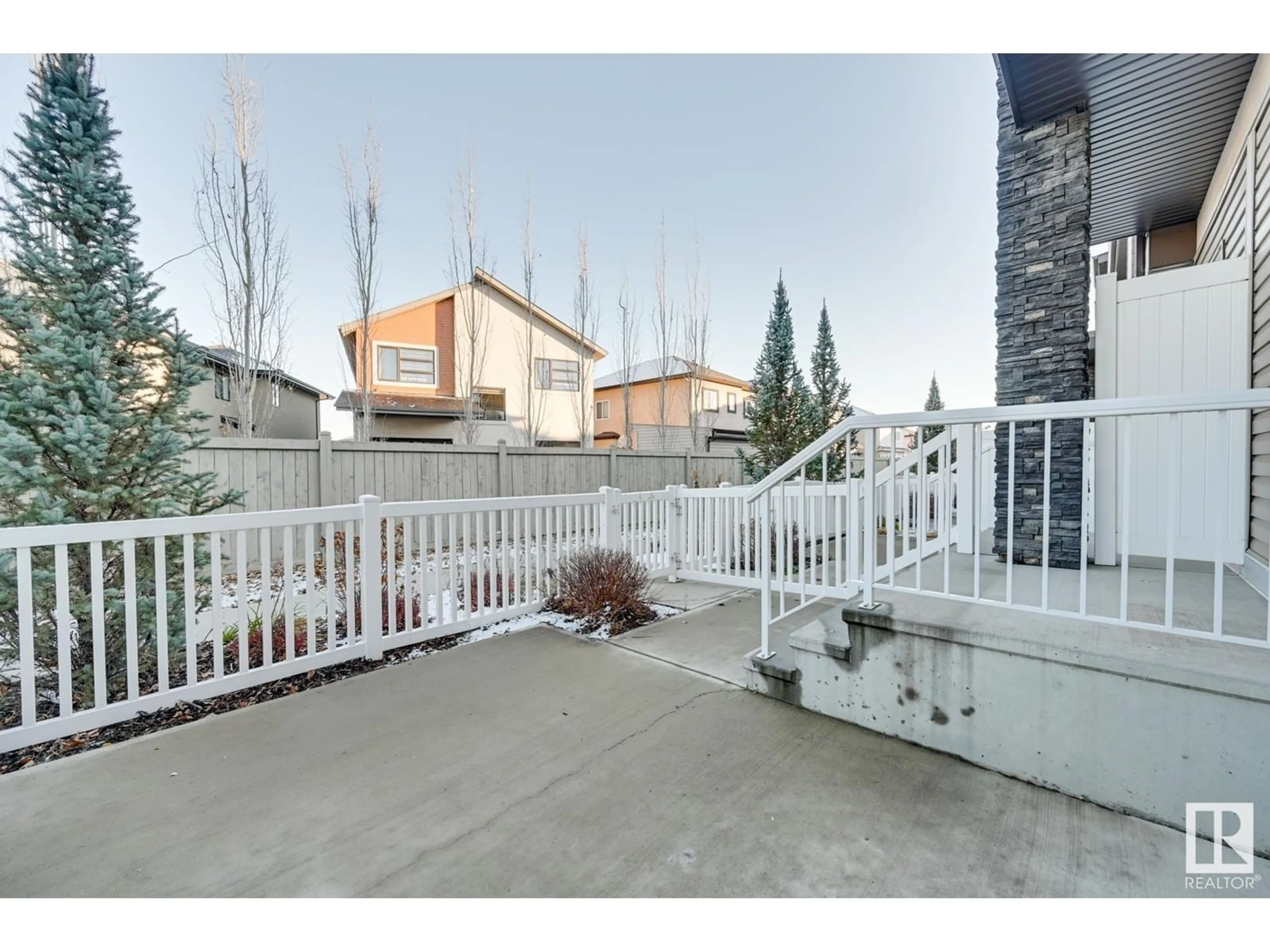 Patio, the fenced backyard for #30 2215 24 ST NW, Edmonton Alberta T6T1A6