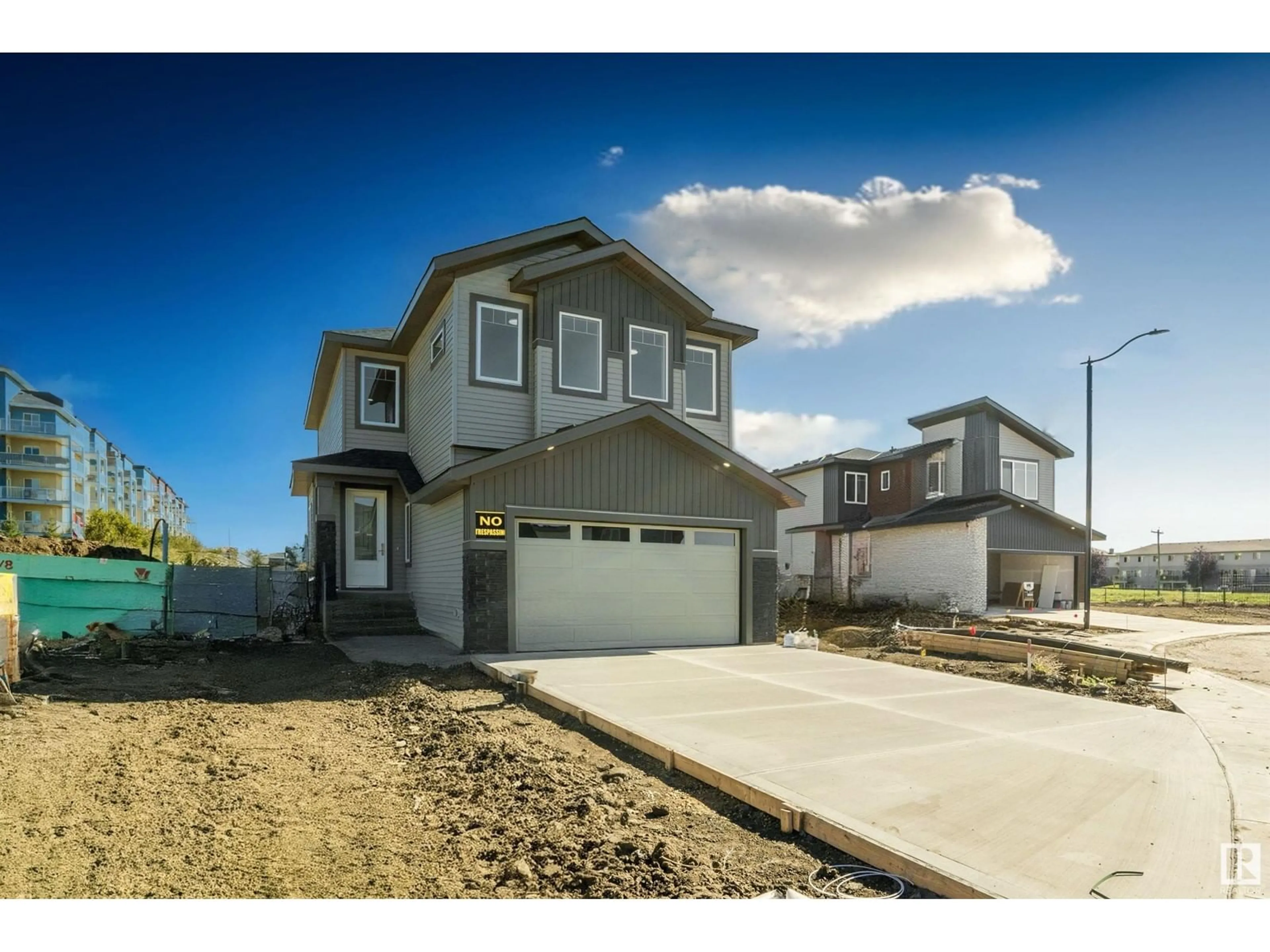 Frontside or backside of a home, the street view for 144 Creekside LN, Leduc Alberta T9E1T1