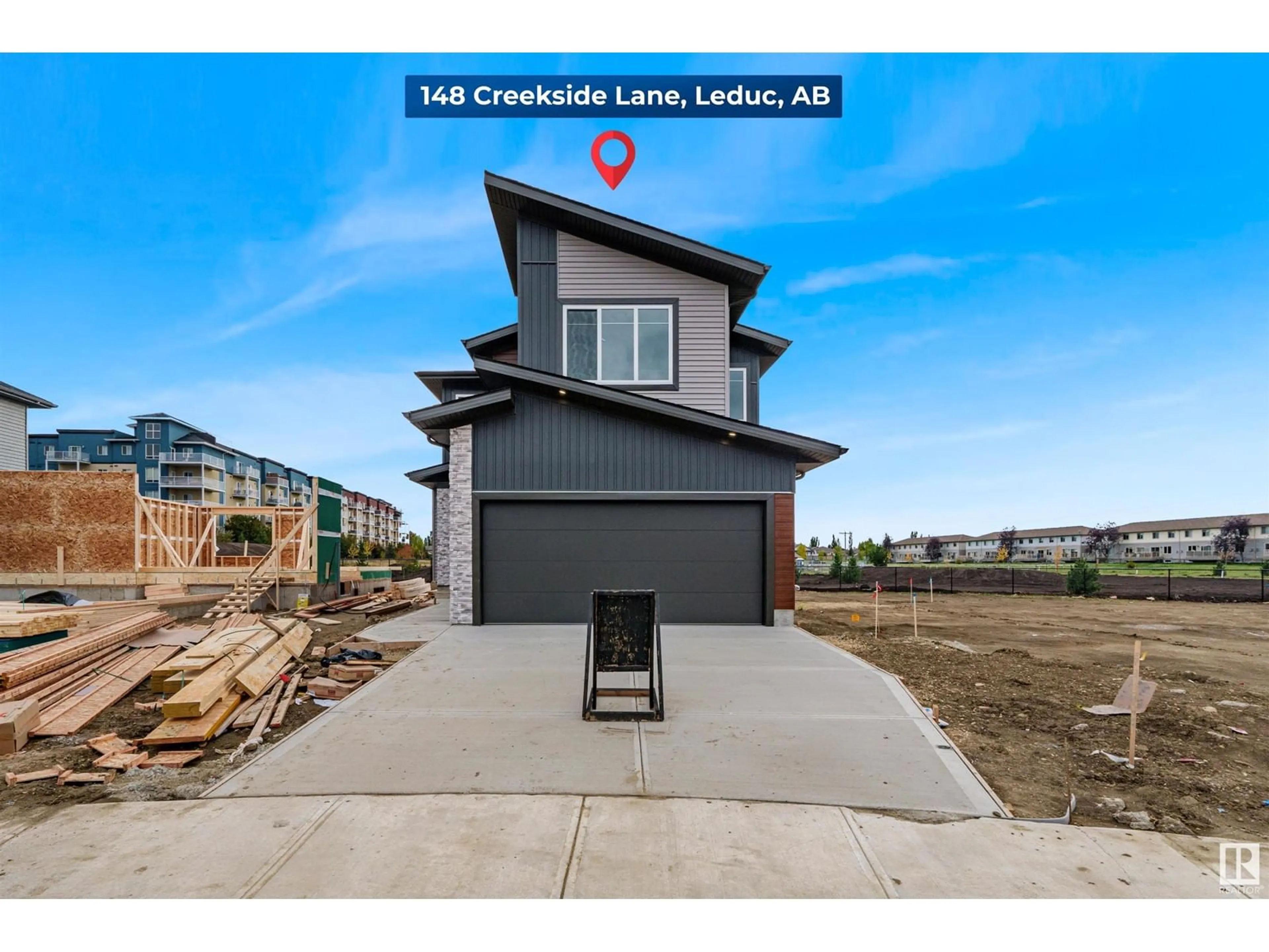 Frontside or backside of a home, the street view for 148 Creekside LN, Leduc Alberta T9E1T1