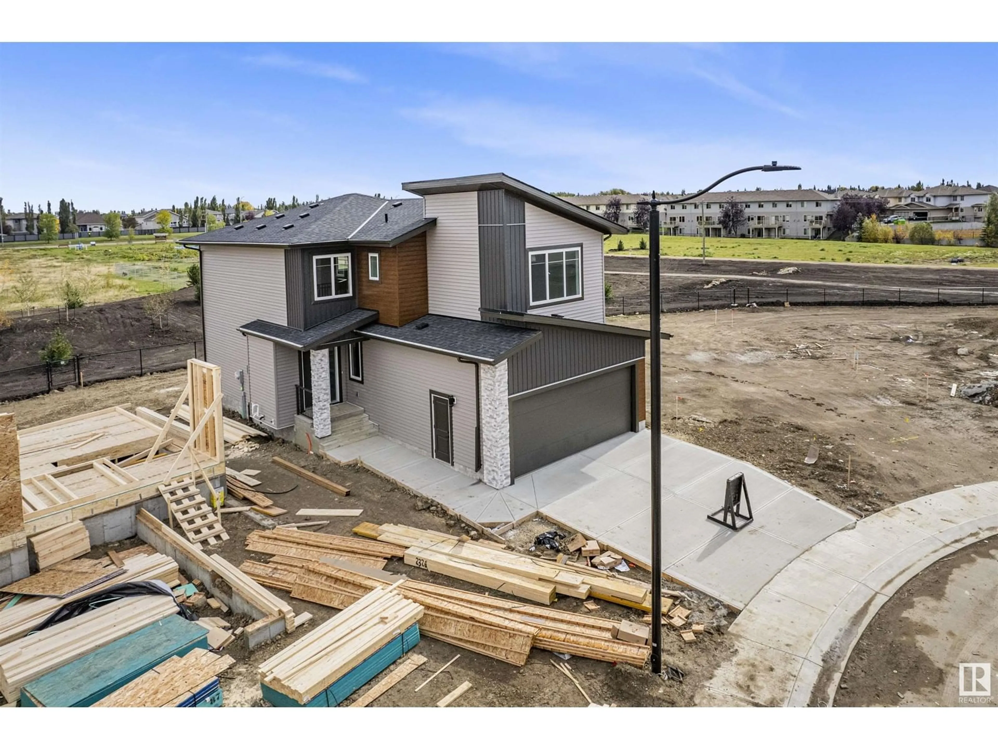 Frontside or backside of a home for 148 Creekside LN, Leduc Alberta T9E1T1