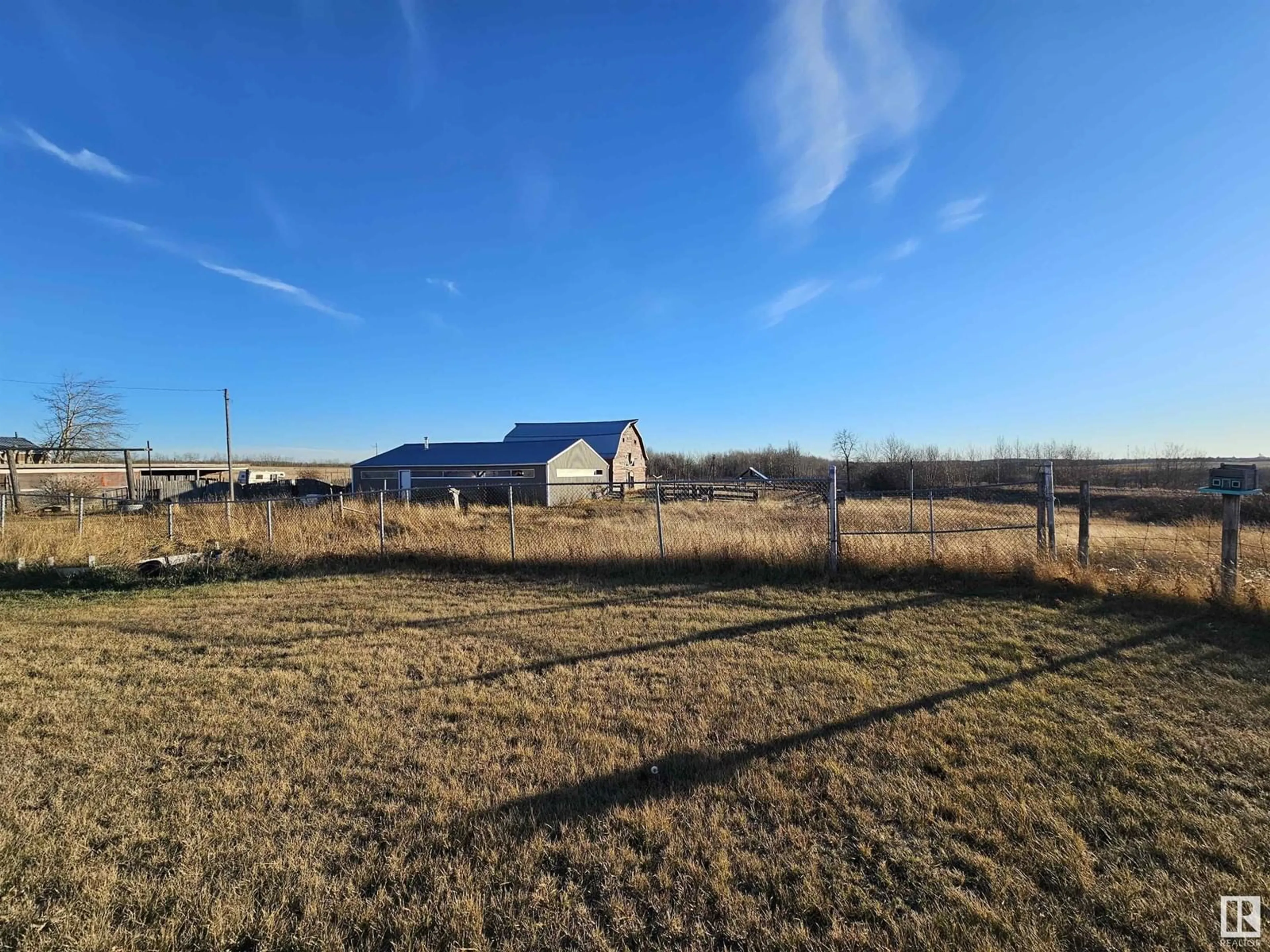 A pic from exterior of the house or condo, the fenced backyard for 23107 TWP ROAD 564, Rural Sturgeon County Alberta T0A1N0