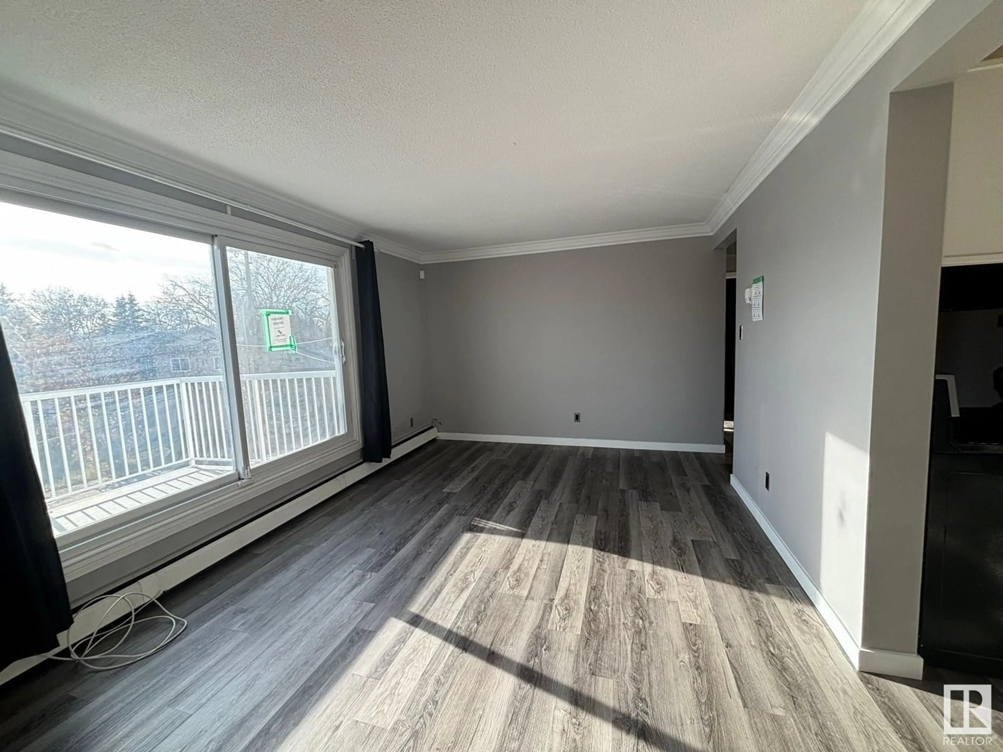 A pic of a room, wood floors for #303 6307 118 AV NW, Edmonton Alberta T5W1G2