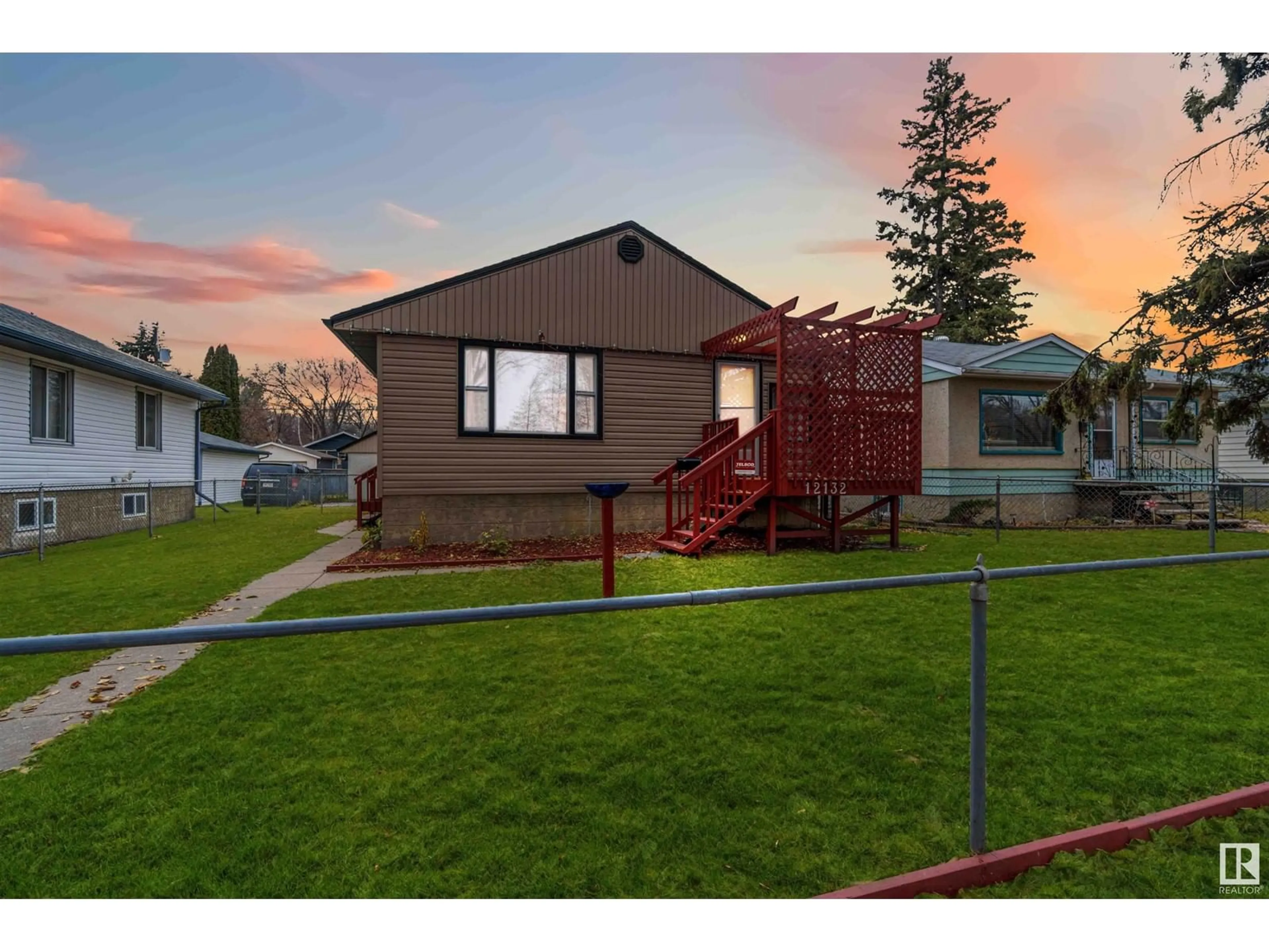 Frontside or backside of a home, the fenced backyard for 12132 57 ST NW, Edmonton Alberta T5W3W1