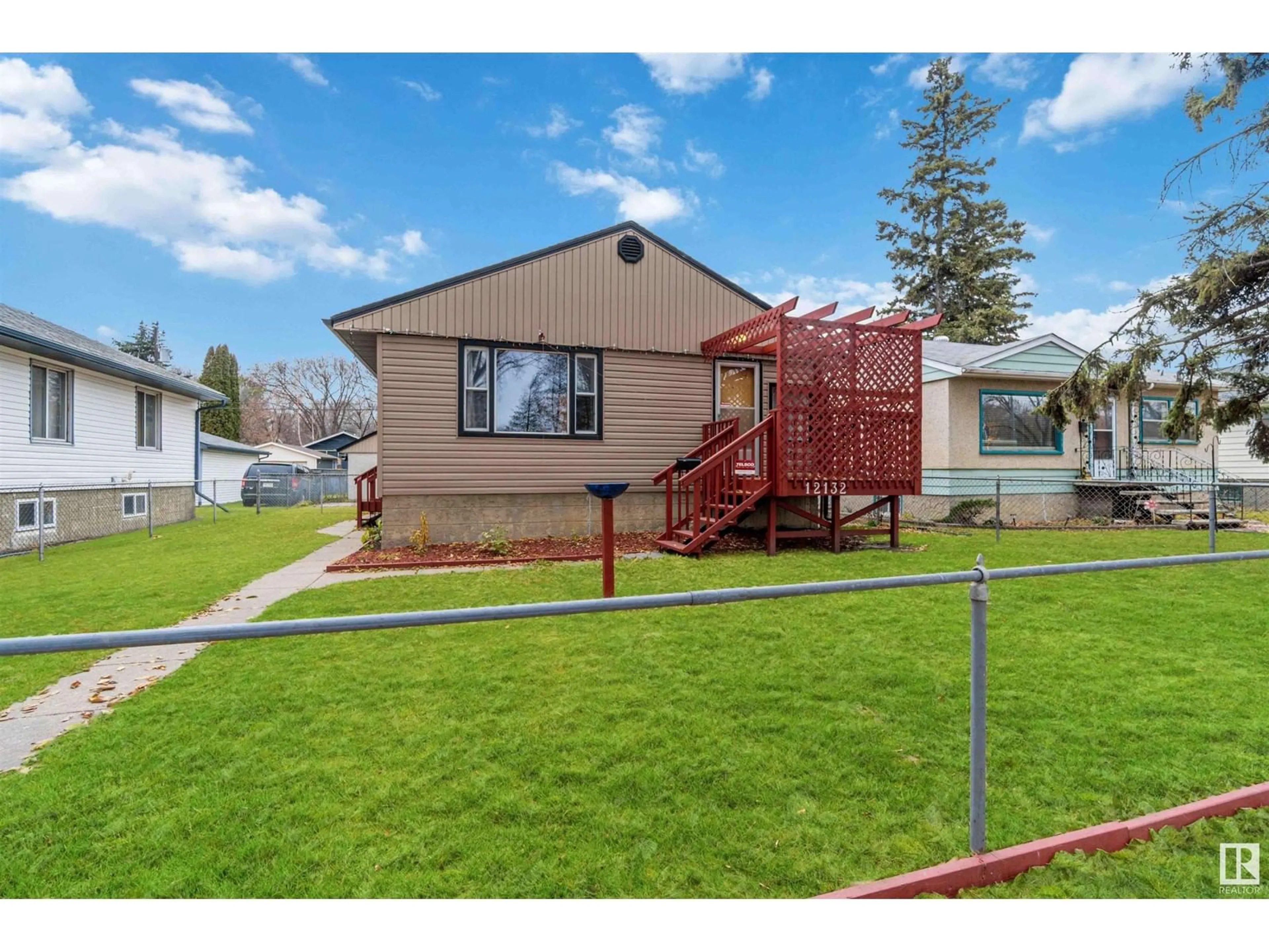 Frontside or backside of a home, the fenced backyard for 12132 57 ST NW, Edmonton Alberta T5W3W1