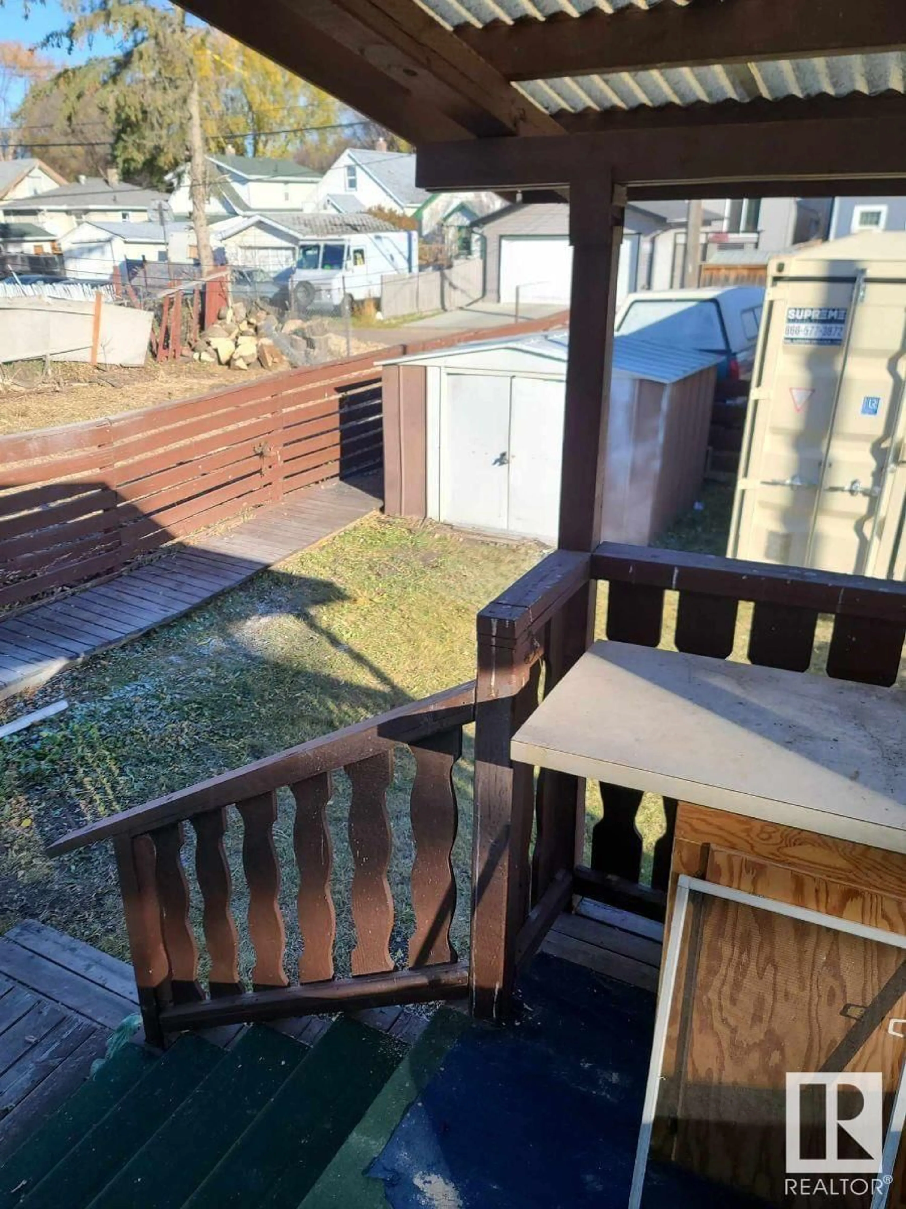 Patio, the fenced backyard for 11303 86 ST NW, Edmonton Alberta T5B3H9