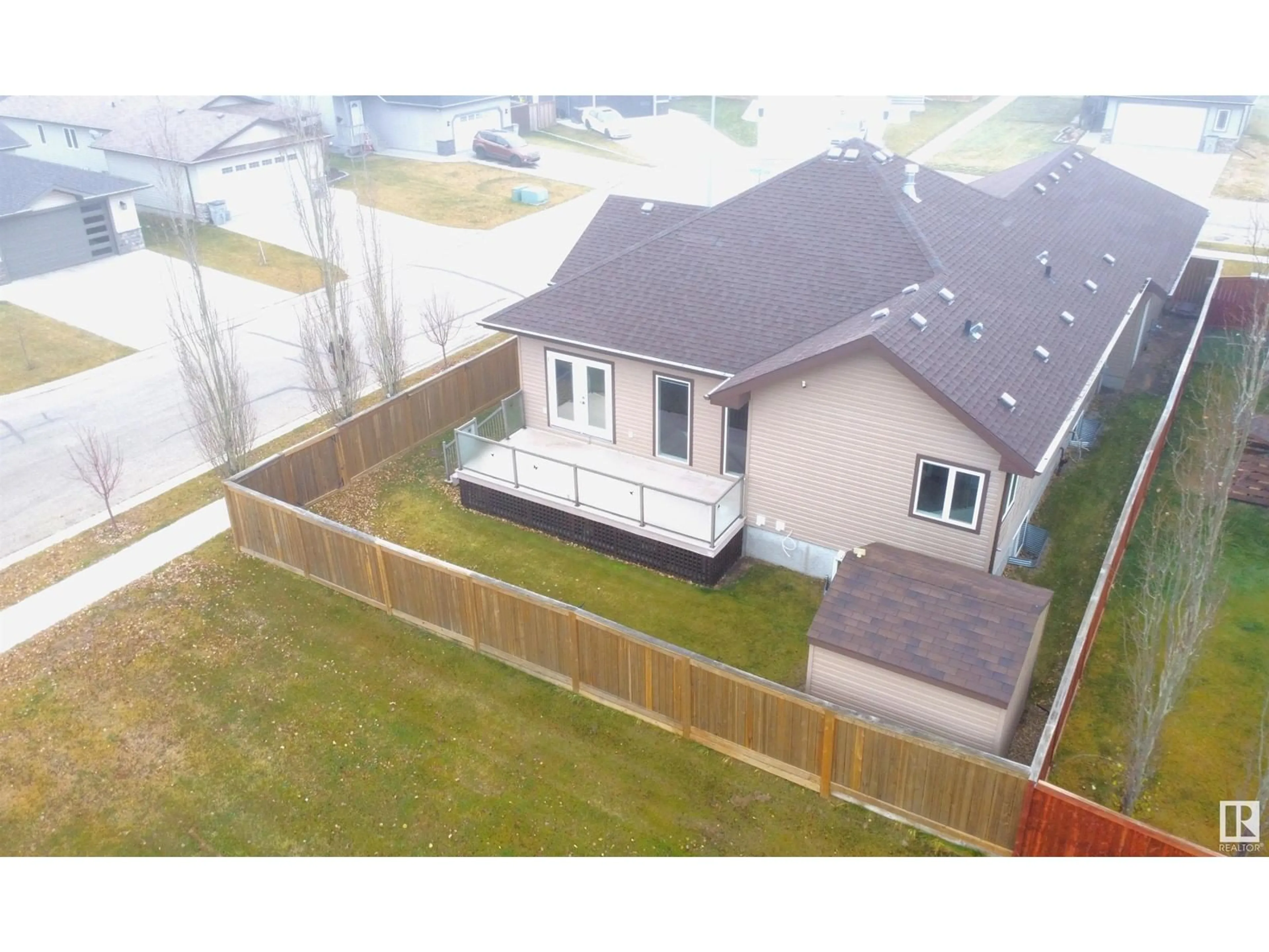 Frontside or backside of a home, the fenced backyard for 5102 53A AV, Legal Alberta T0G1L0