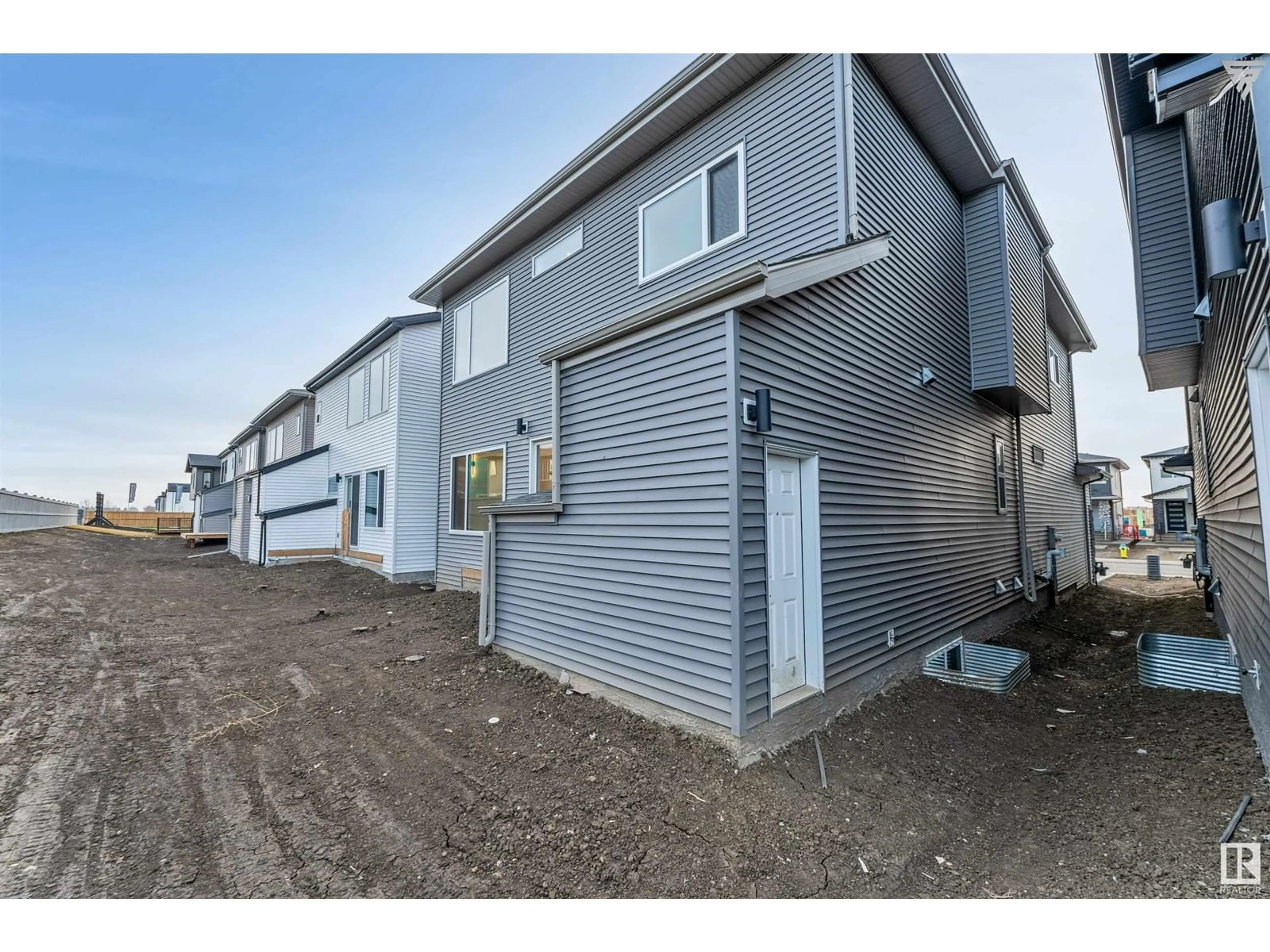 A pic from exterior of the house or condo, the front or back of building for 7015 KIVIAQ CR SW, Edmonton Alberta T6W5N6