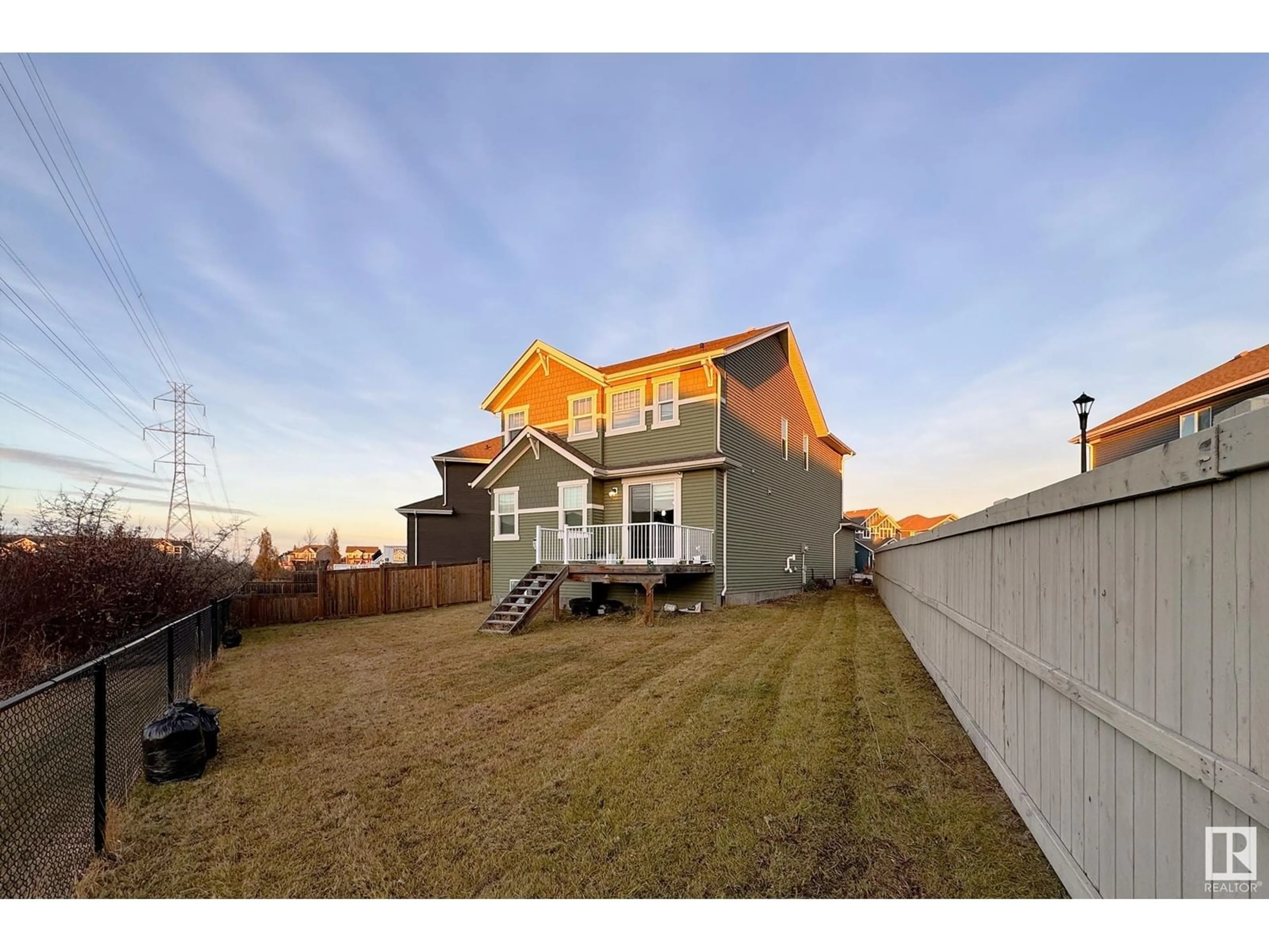 Frontside or backside of a home, the fenced backyard for 3938 cherry cove SW SW, Edmonton Alberta T6X2B3