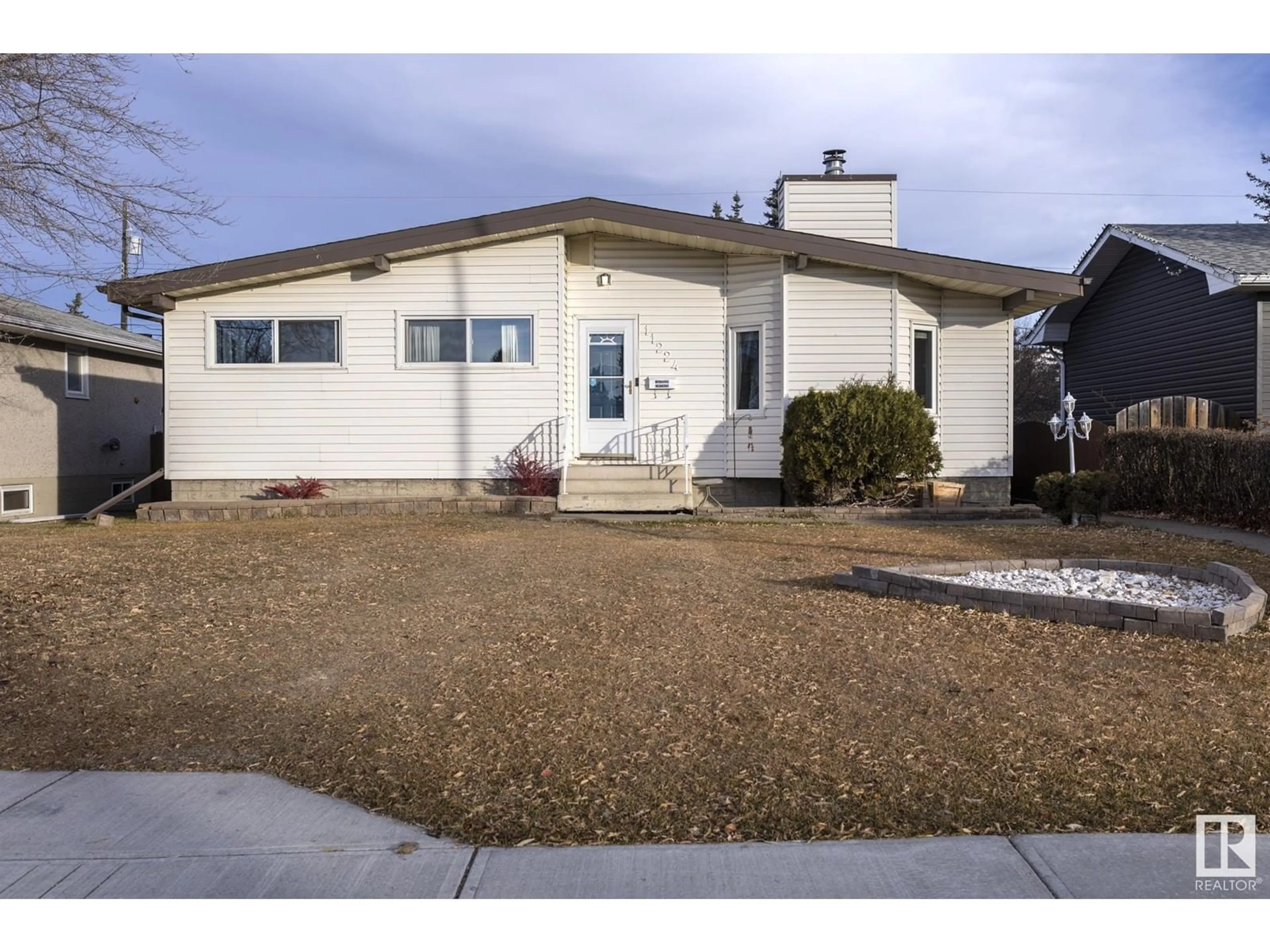 Frontside or backside of a home for 11224 136 AV NW, Edmonton Alberta T5E1X1