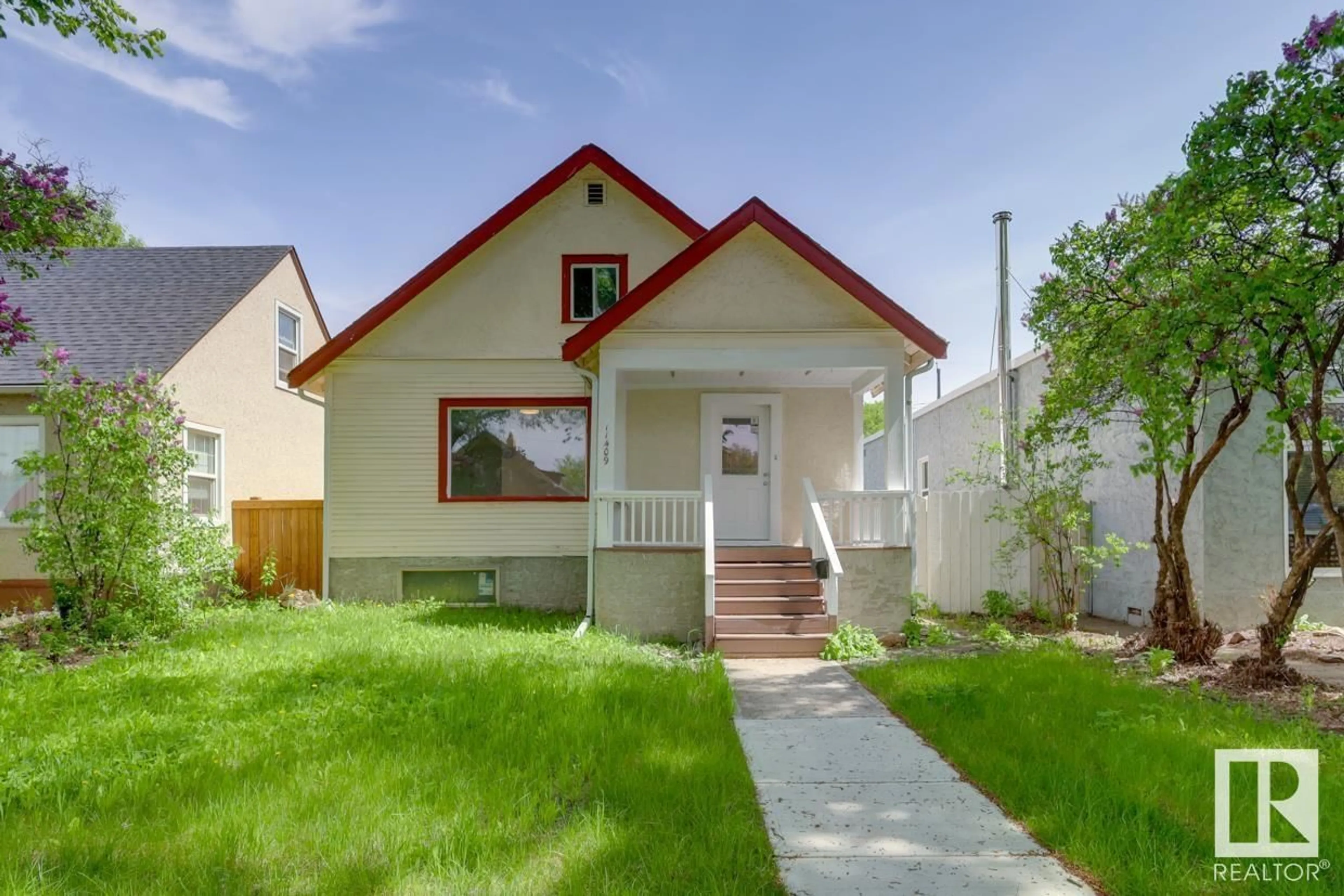 Frontside or backside of a home, the fenced backyard for 11409 90 ST NW, Edmonton Alberta T5B3X8