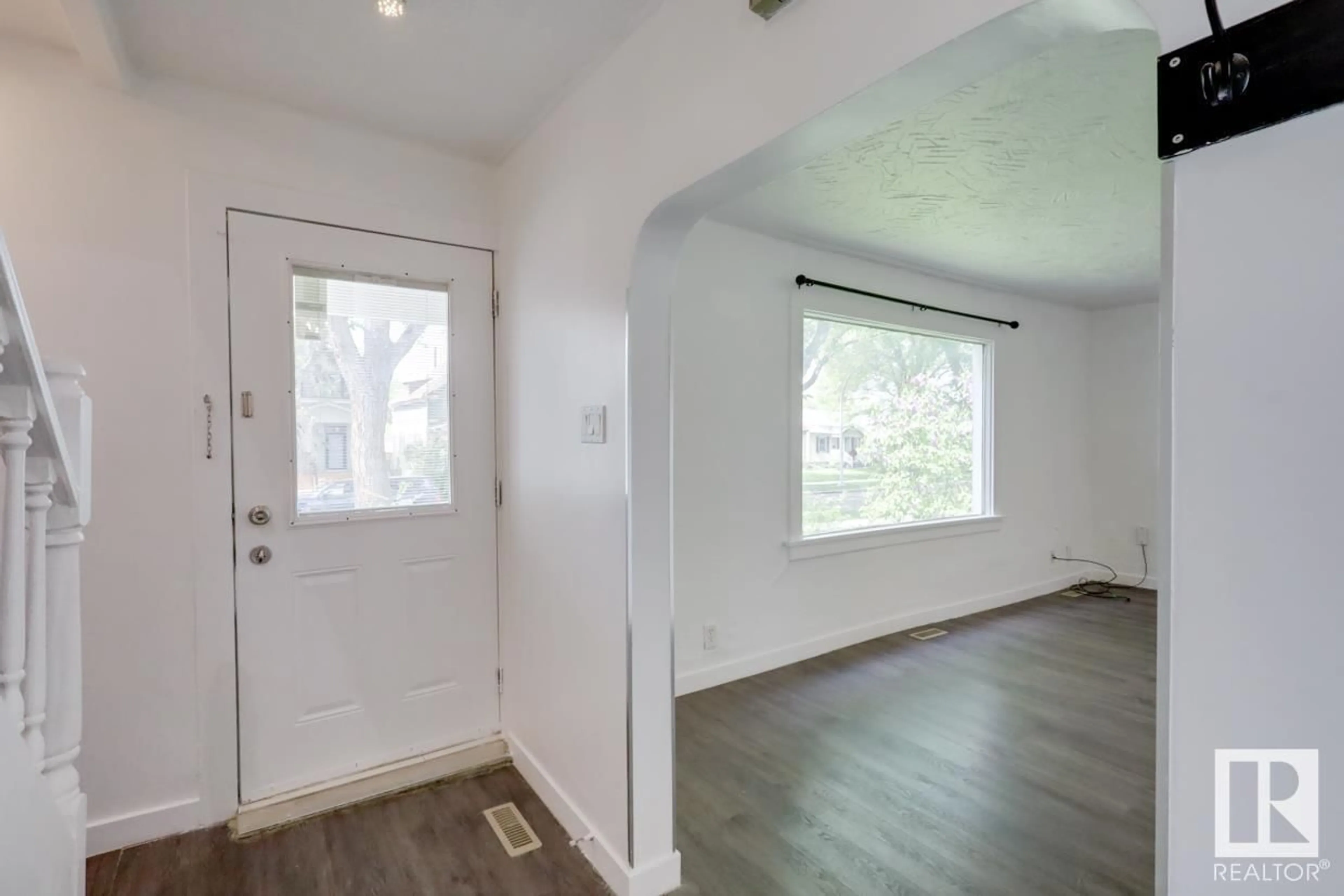 Indoor entryway, wood floors for 11409 90 ST NW, Edmonton Alberta T5B3X8