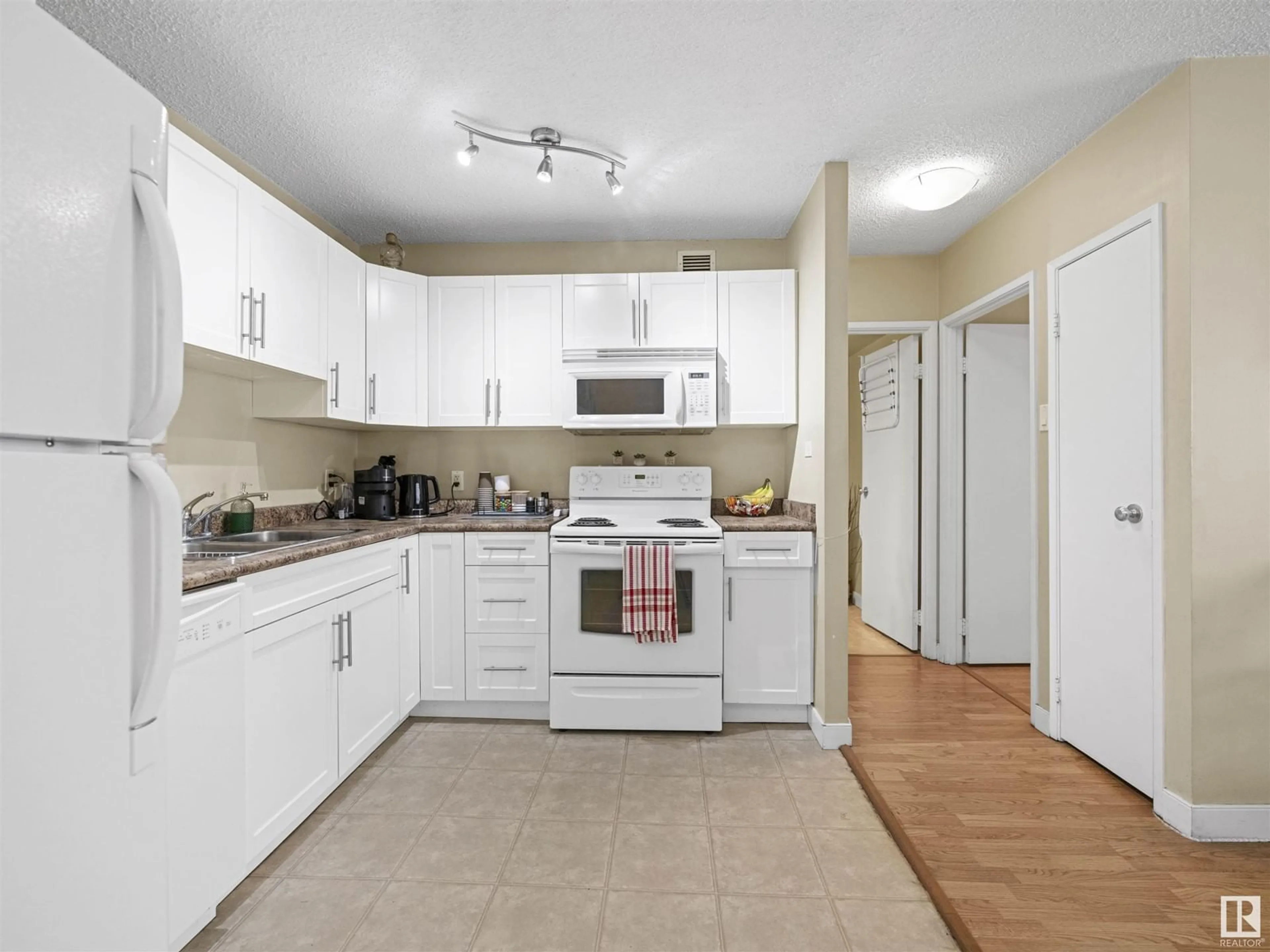 Standard kitchen, wood floors for #409 9710 105 ST NW, Edmonton Alberta T5K1A4