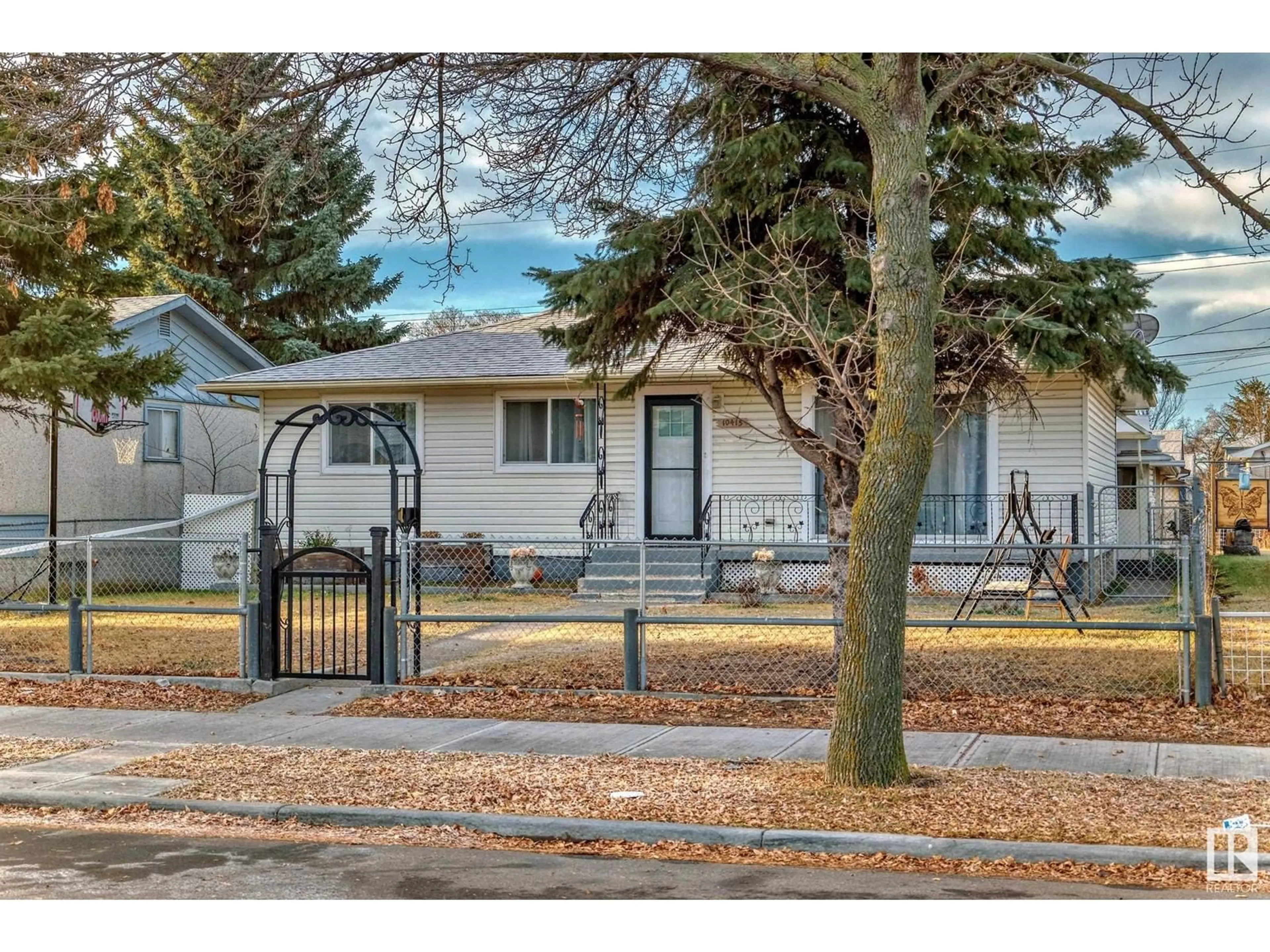 Frontside or backside of a home, the fenced backyard for 10415 LAUDER AV NW, Edmonton Alberta T5E5P9