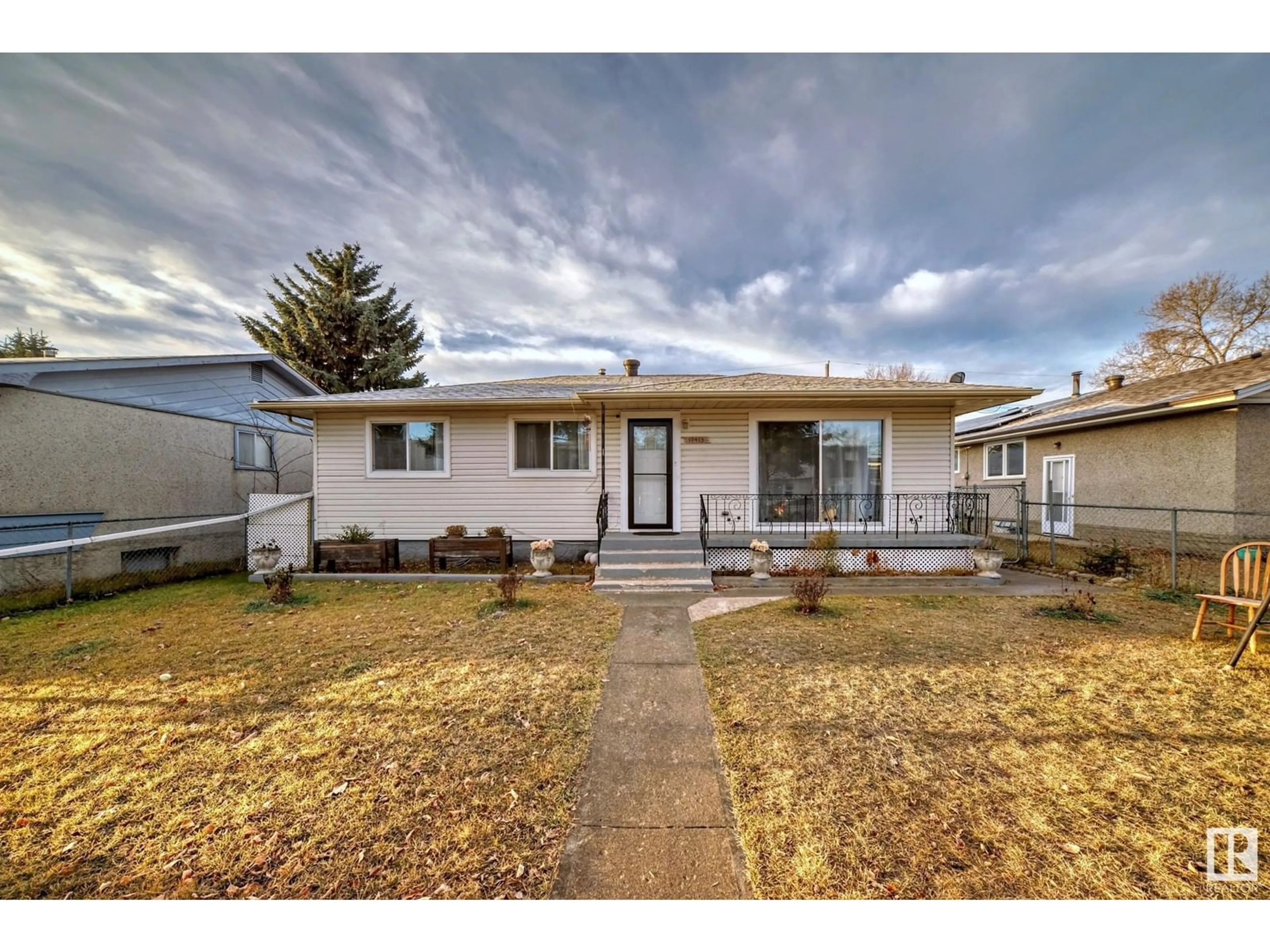 Frontside or backside of a home, the fenced backyard for 10415 LAUDER AV NW, Edmonton Alberta T5E5P9