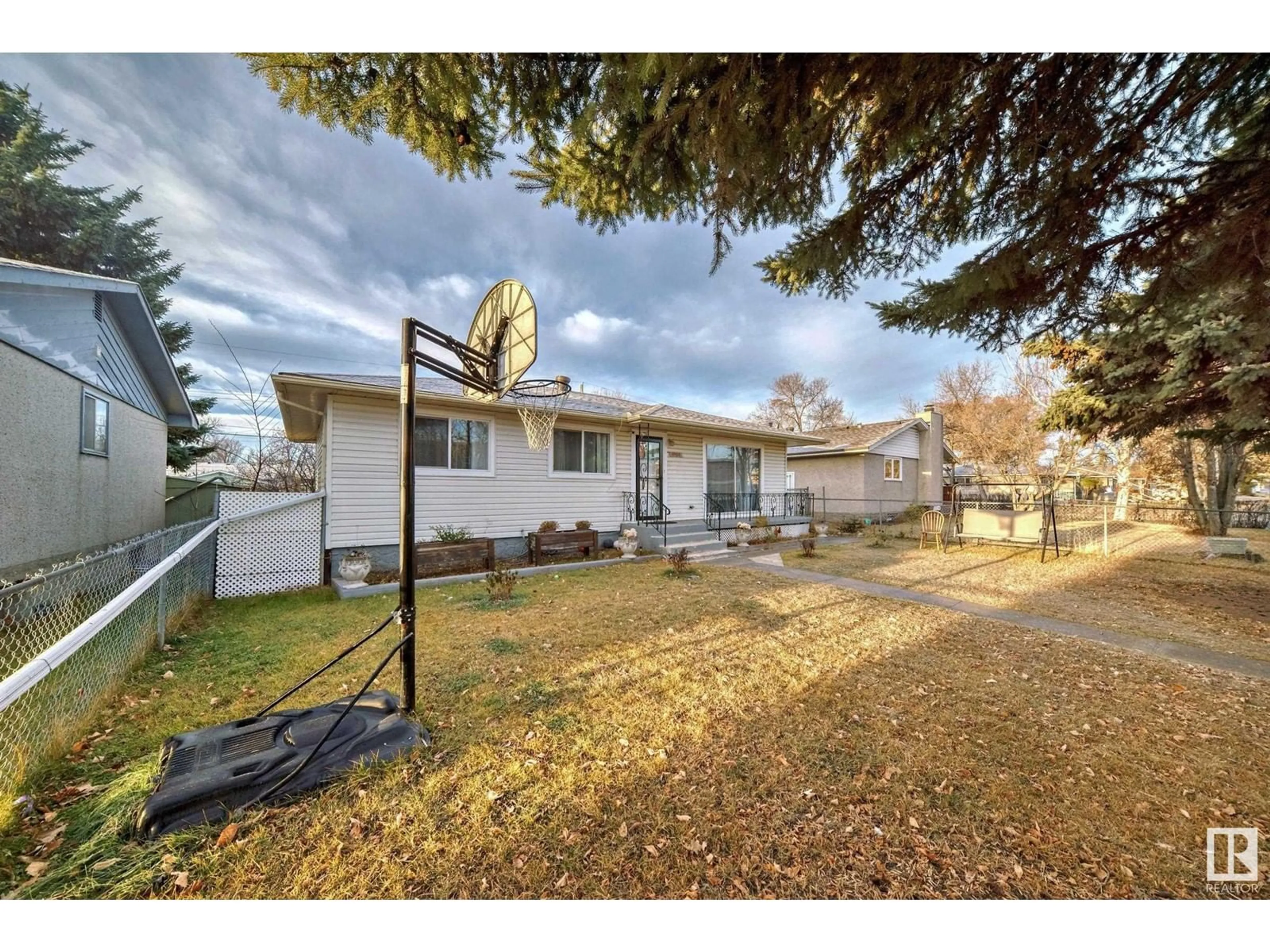 Frontside or backside of a home, the fenced backyard for 10415 LAUDER AV NW, Edmonton Alberta T5E5P9