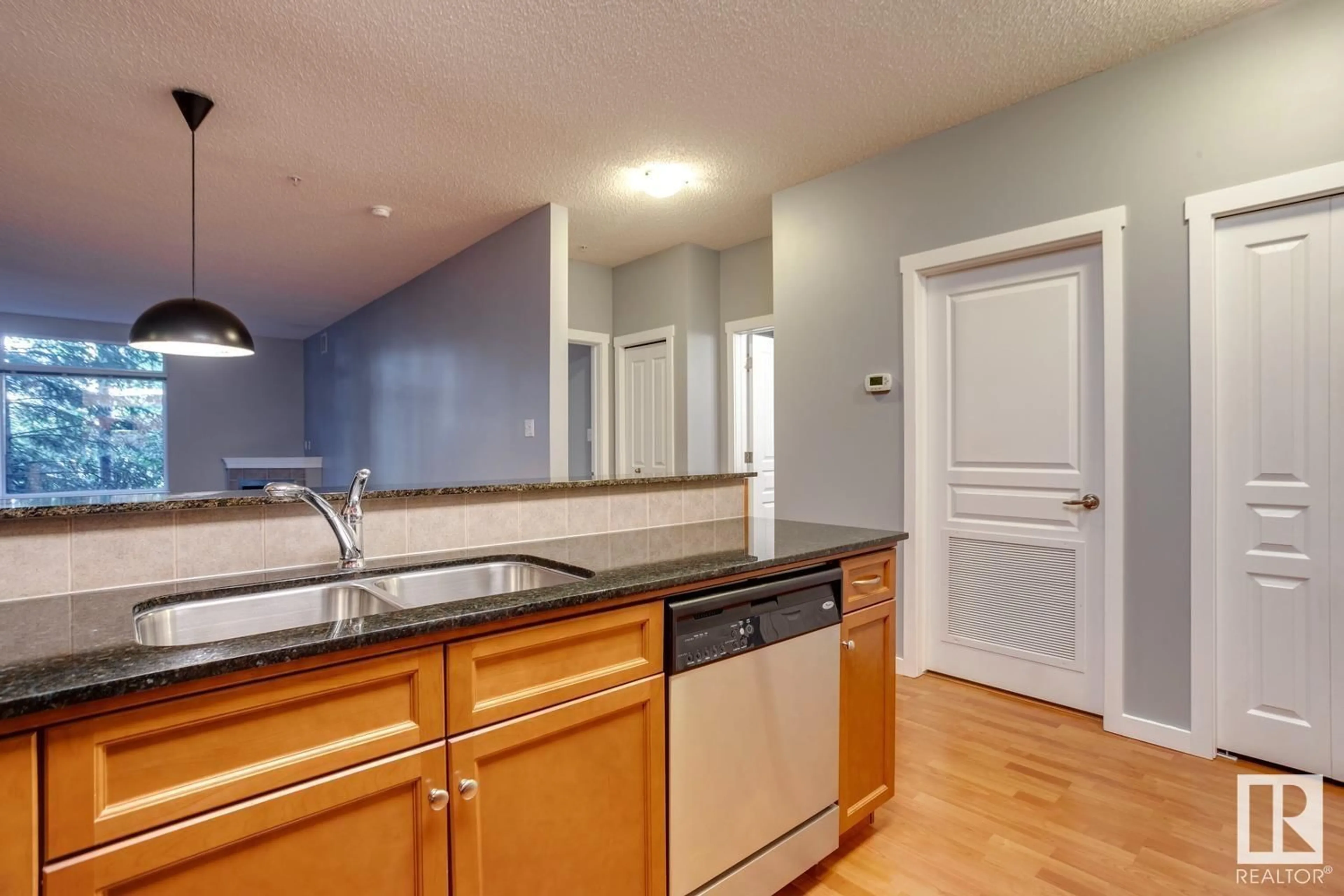 Open concept kitchen for #105 11140 68 AV NW, Edmonton Alberta T6H0L4