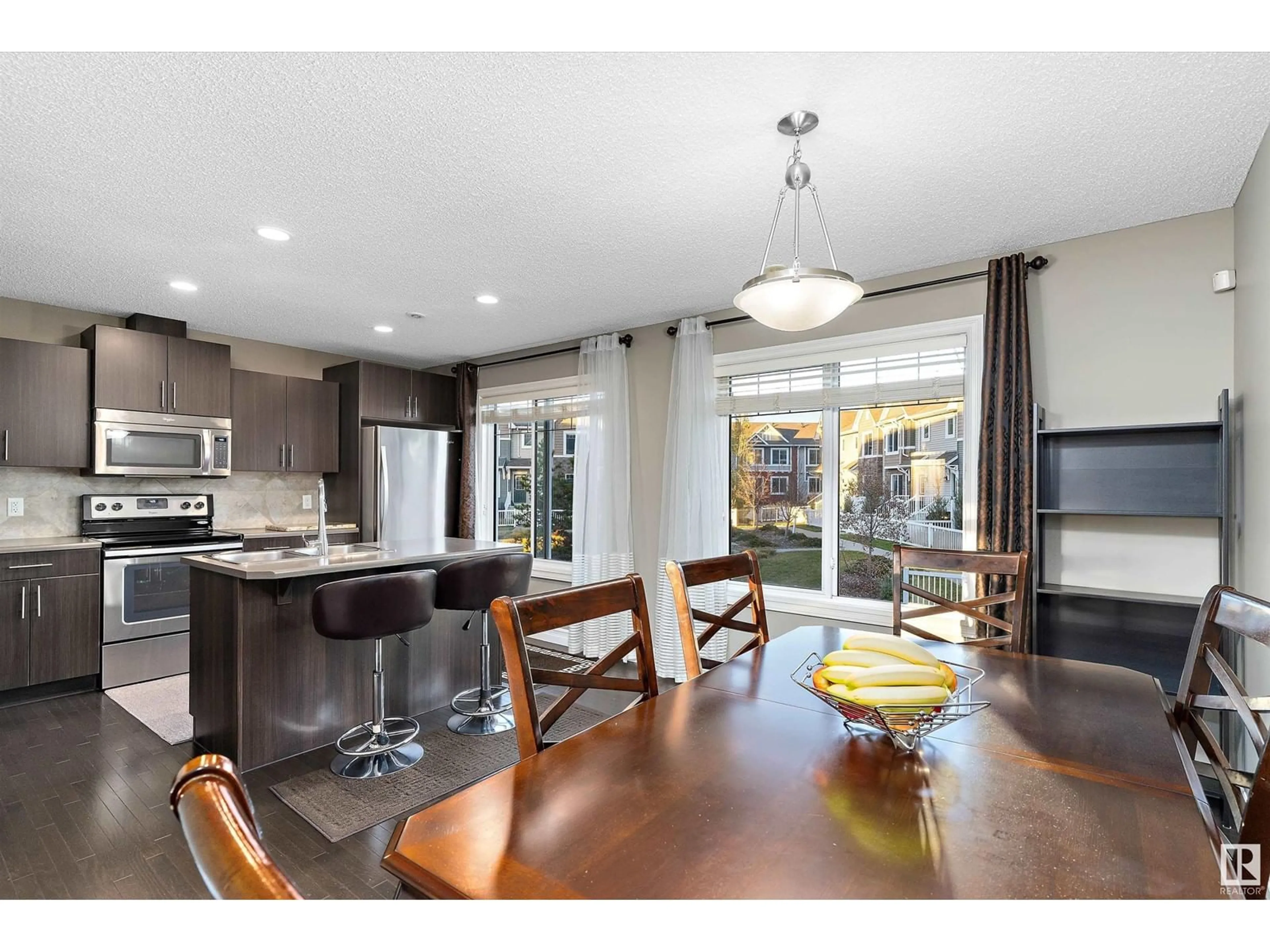 Open concept kitchen for #61 3625 144 AV NW, Edmonton Alberta T5Y0T3