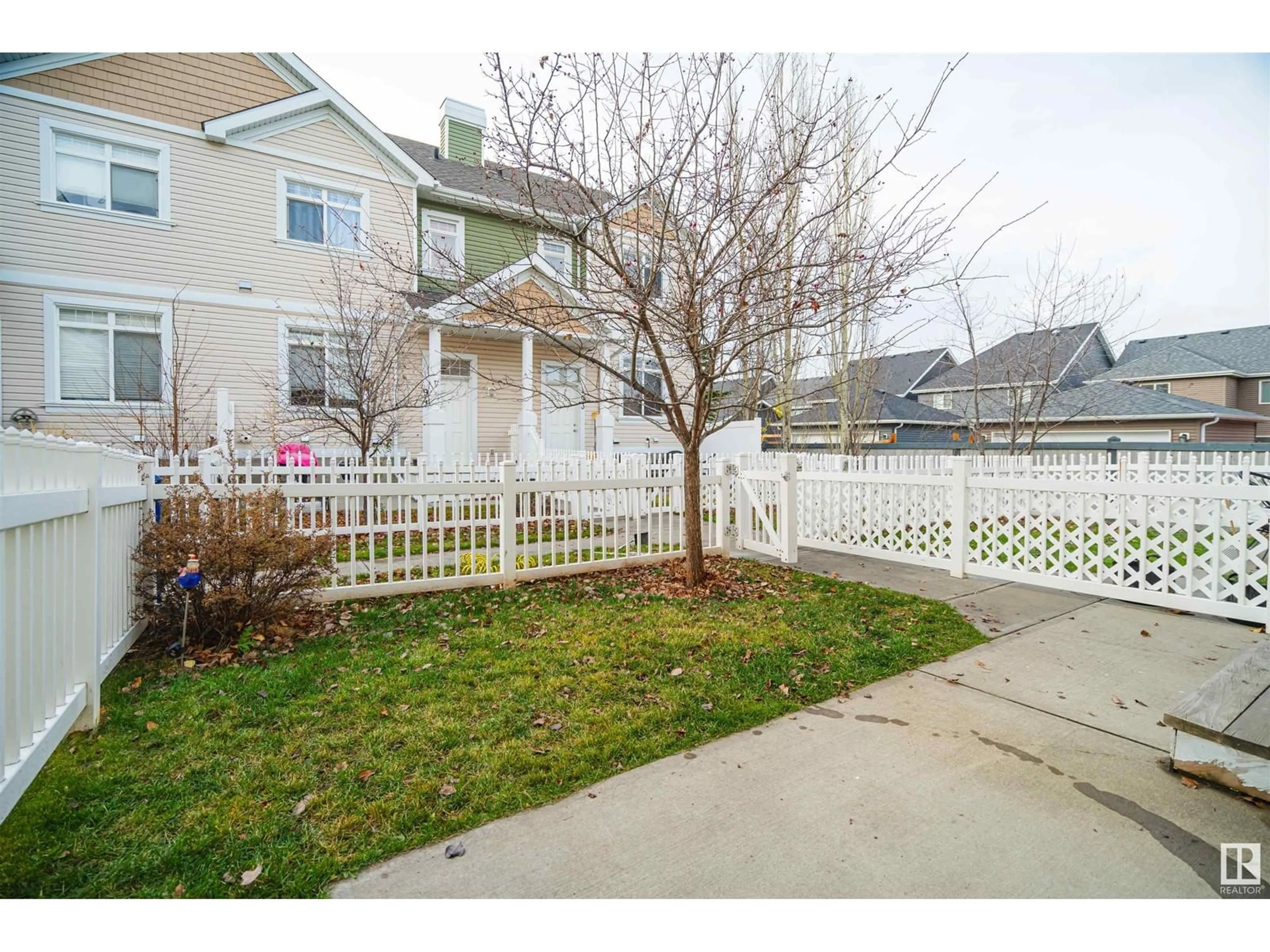 A pic from exterior of the house or condo, the fenced backyard for #91 1804 70 ST SW, Edmonton Alberta T6X0H4