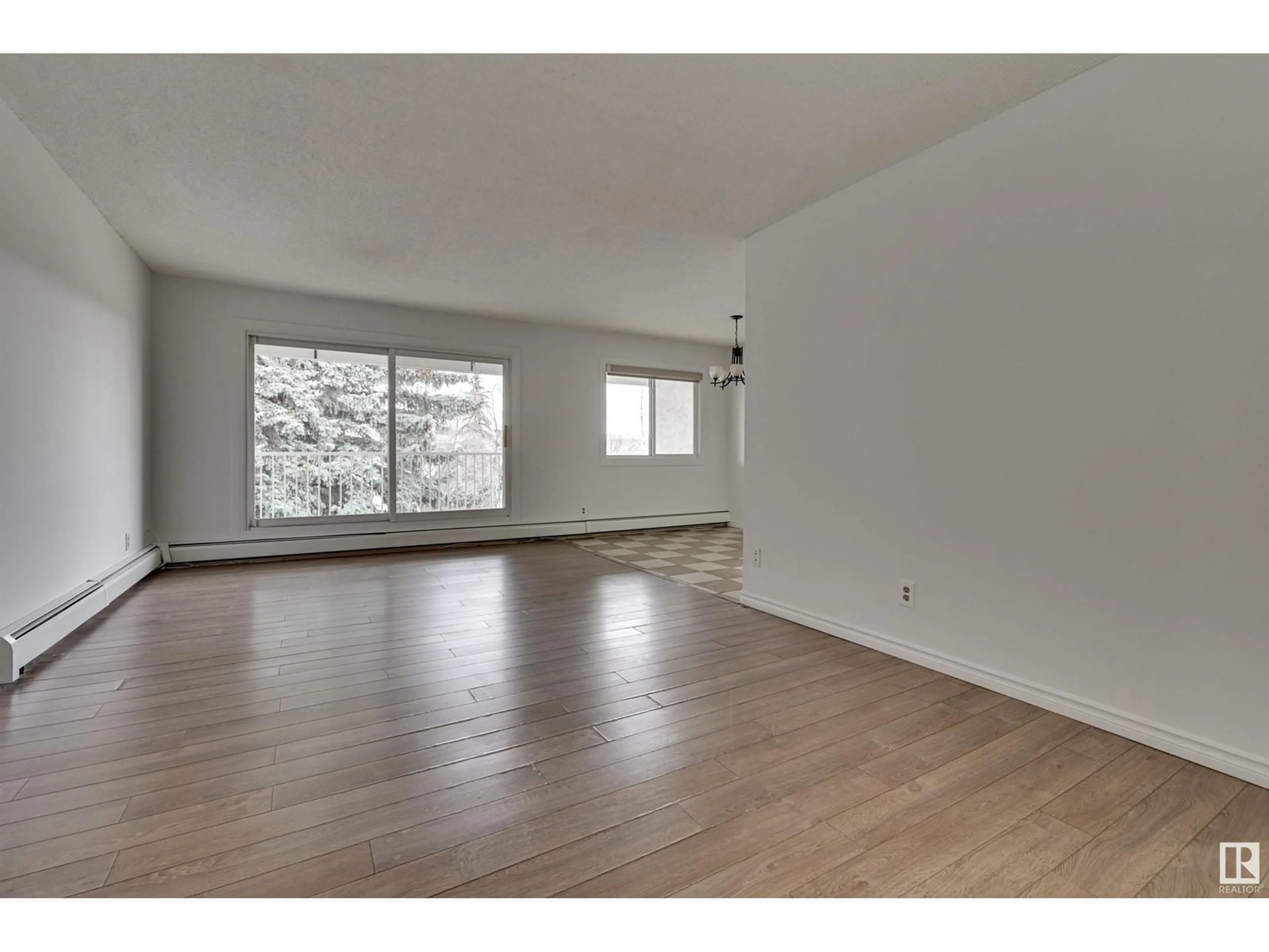 A pic of a room, wood floors for #308 14825 51 AV NW, Edmonton Alberta T6H5G4