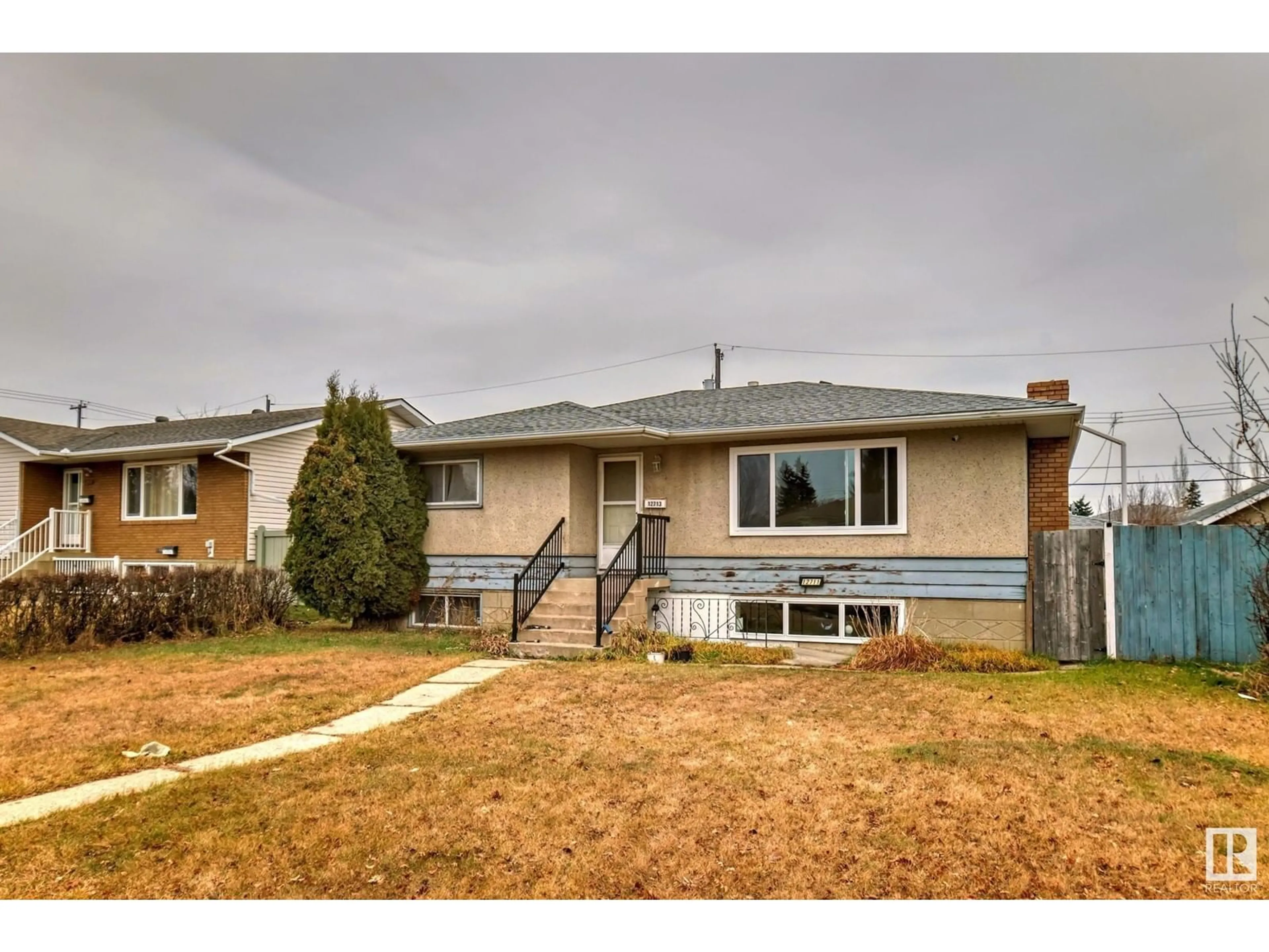 Frontside or backside of a home, the fenced backyard for 12711 95 ST NW, Edmonton Alberta T5E3X8