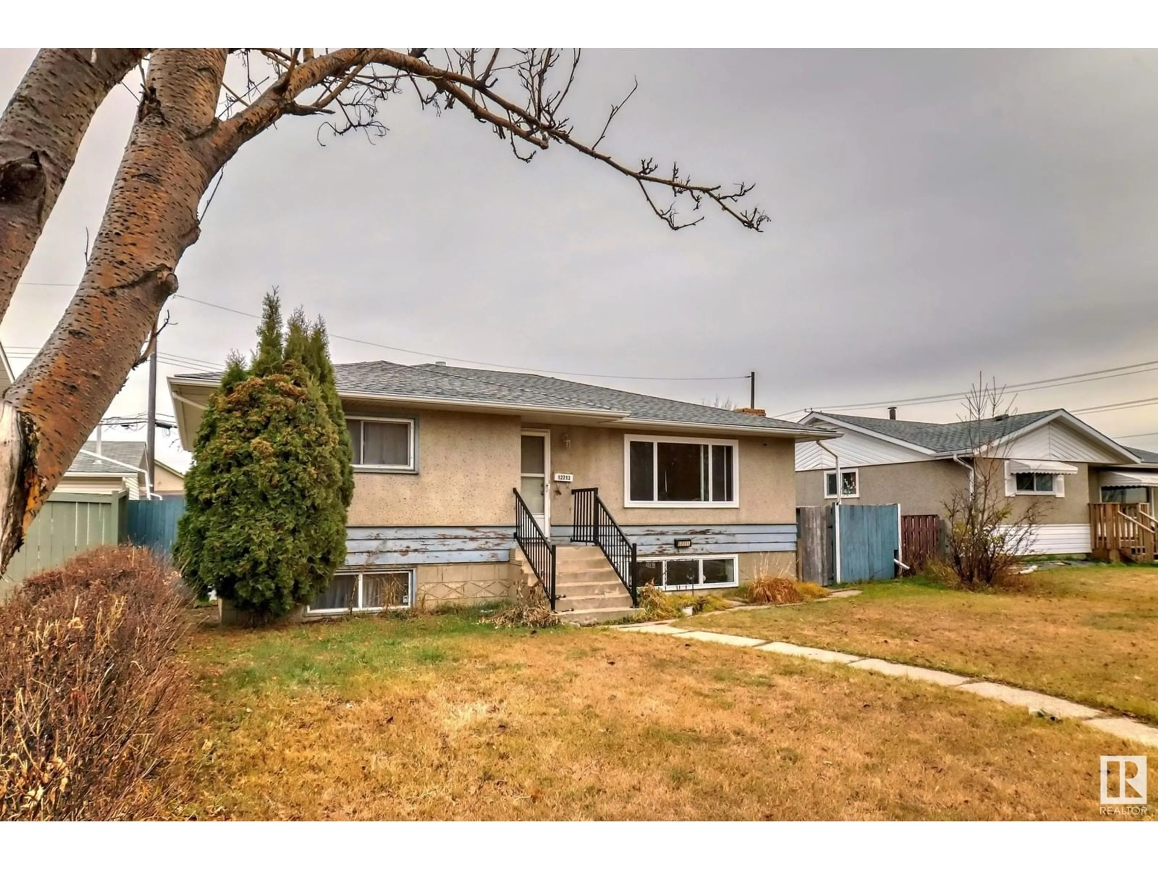 Frontside or backside of a home, the fenced backyard for 12711 95 ST NW, Edmonton Alberta T5E3X8