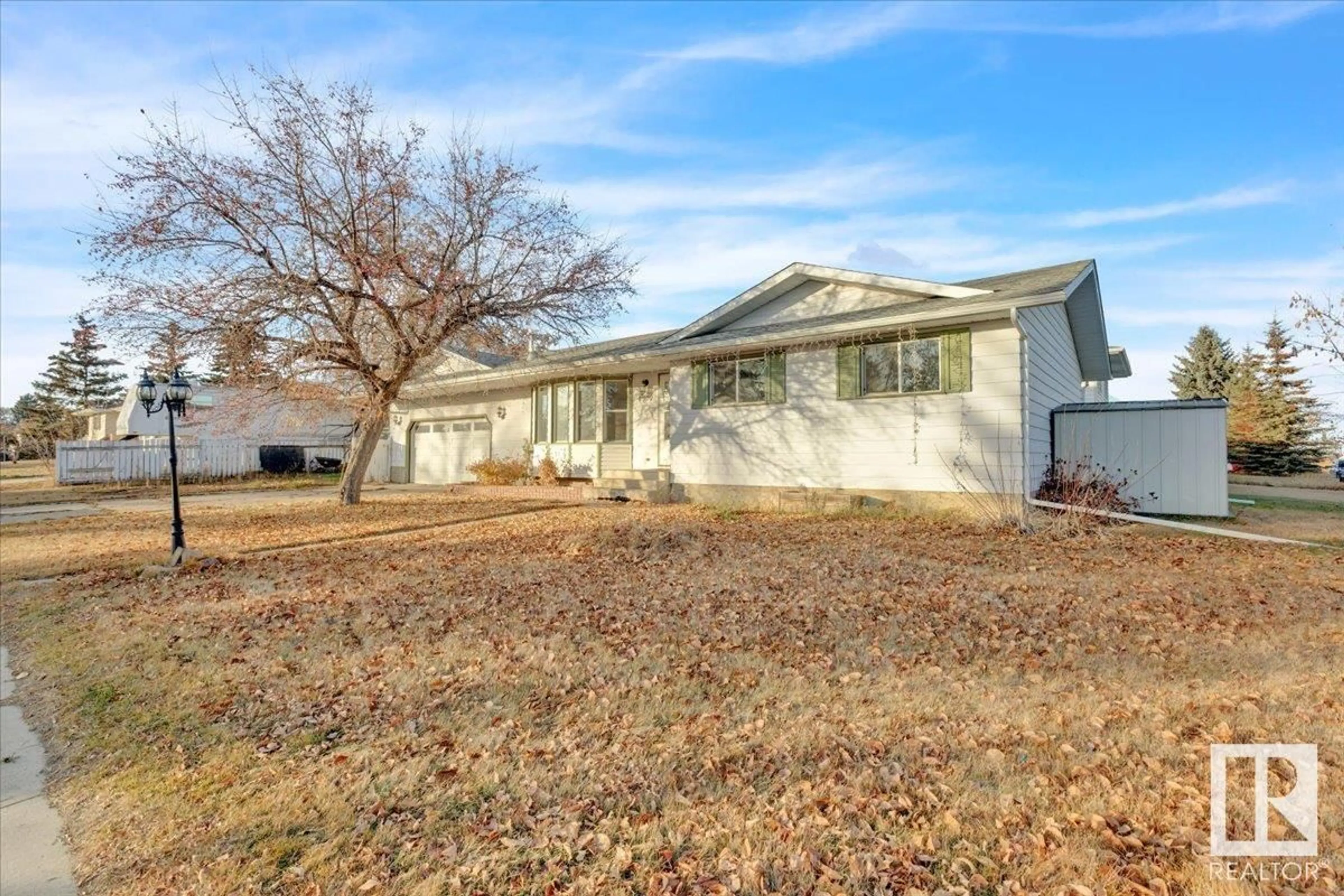 Frontside or backside of a home, the fenced backyard for 4502 53 AV, Bruderheim Alberta T0B0S0