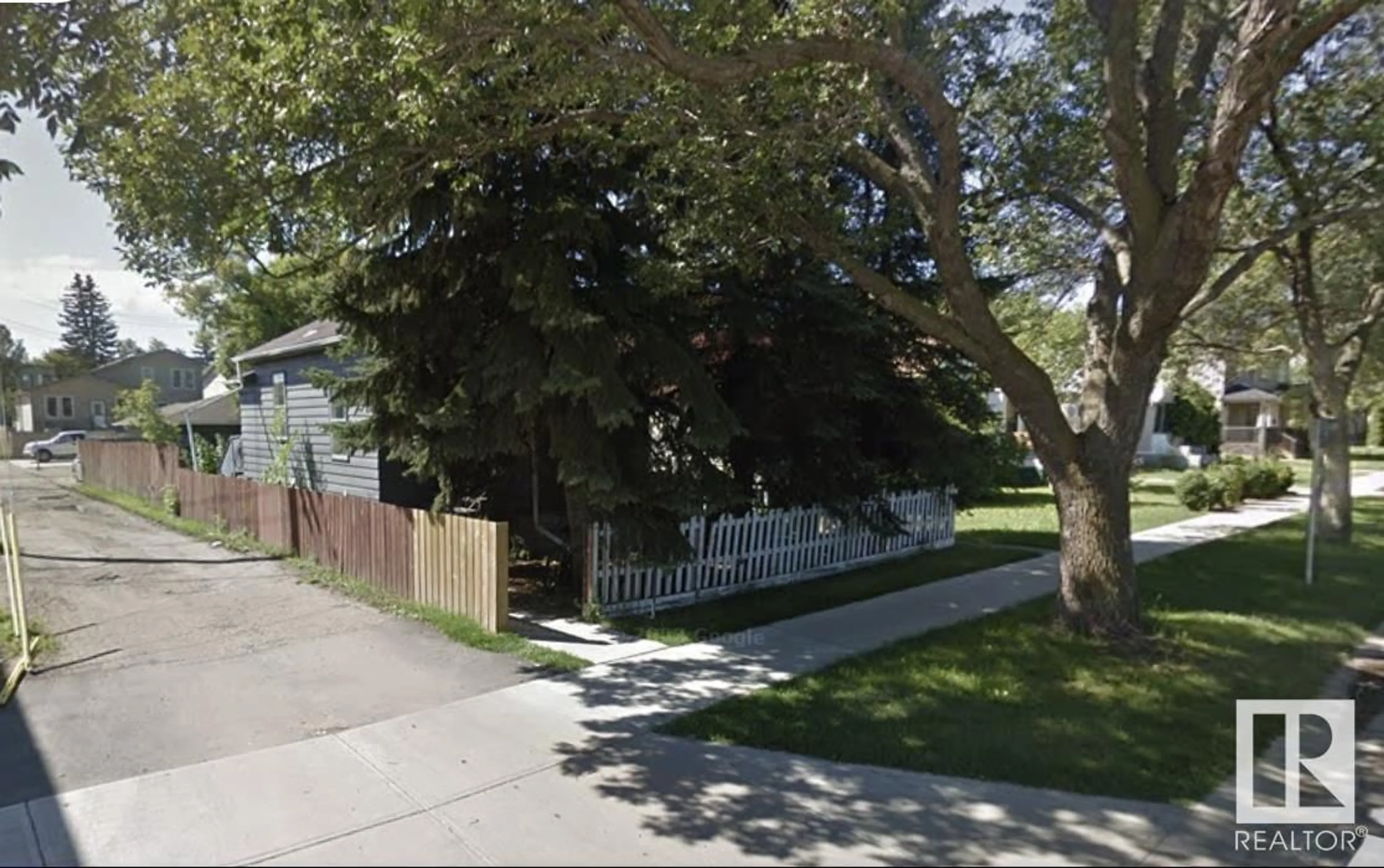 Frontside or backside of a home, the street view for 10417 70 AV NW, Edmonton Alberta T6H2E7