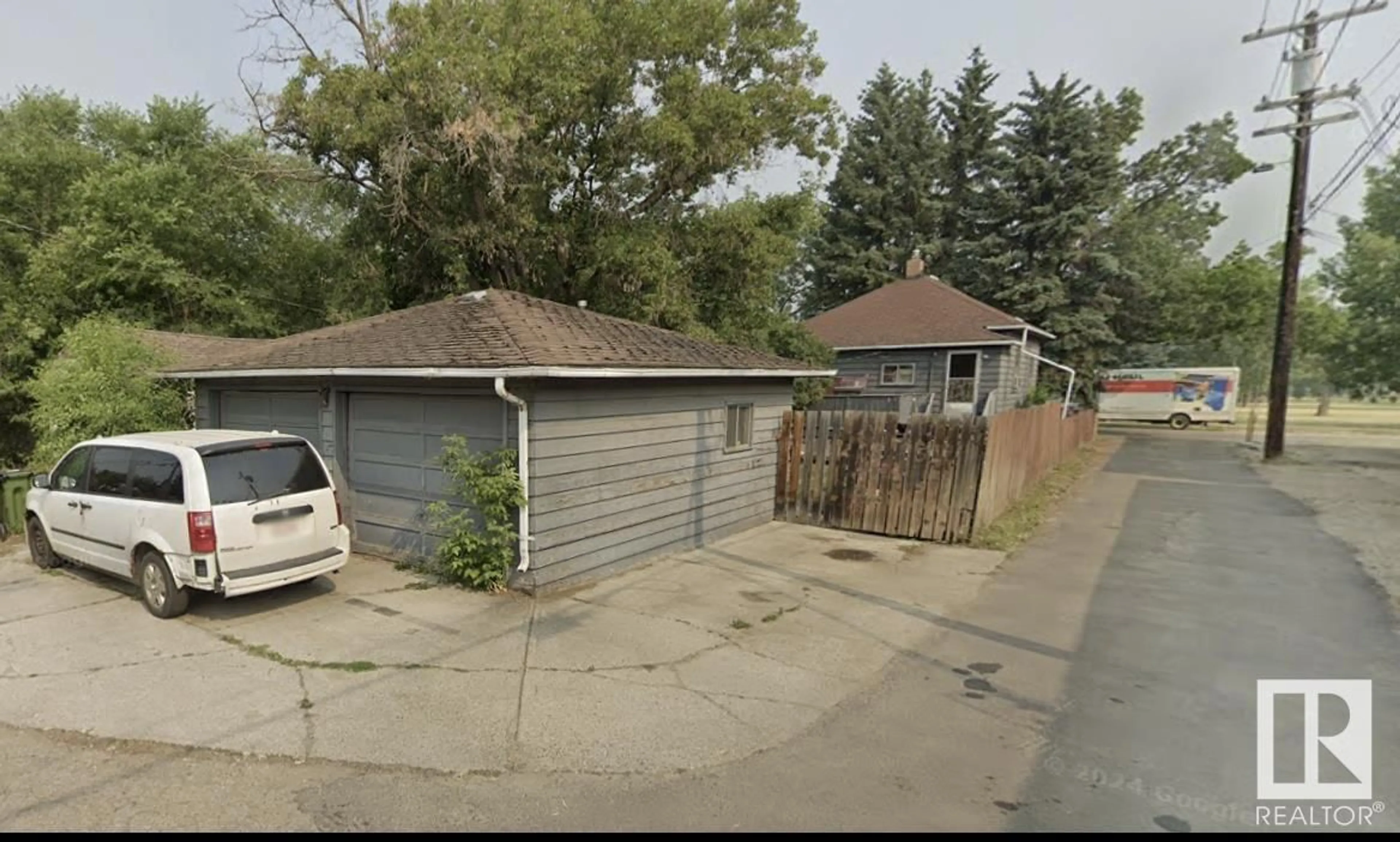 Frontside or backside of a home, the street view for 10417 70 AV NW, Edmonton Alberta T6H2E7