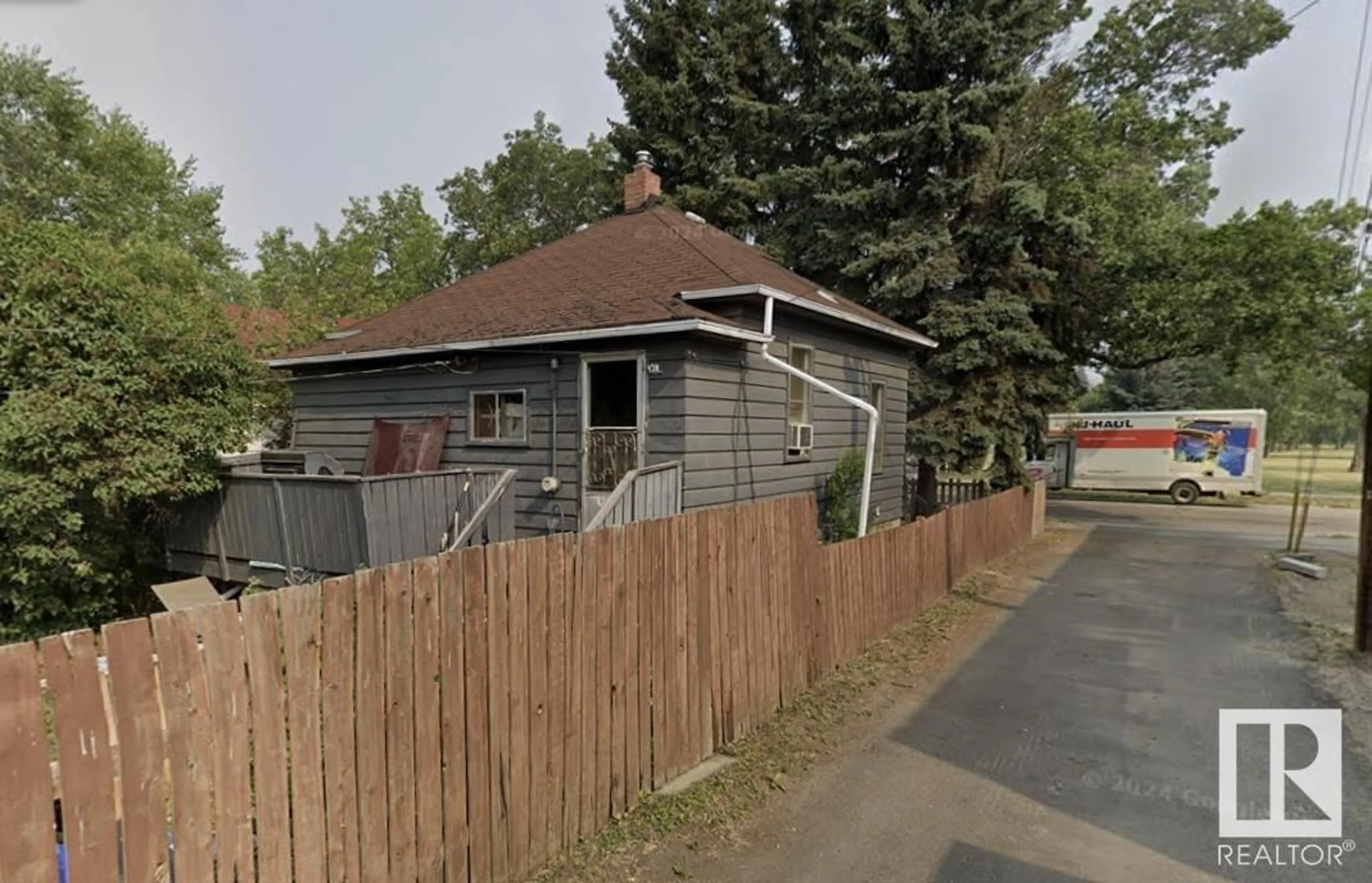 Frontside or backside of a home, the street view for 10417 70 AV NW, Edmonton Alberta T6H2E7