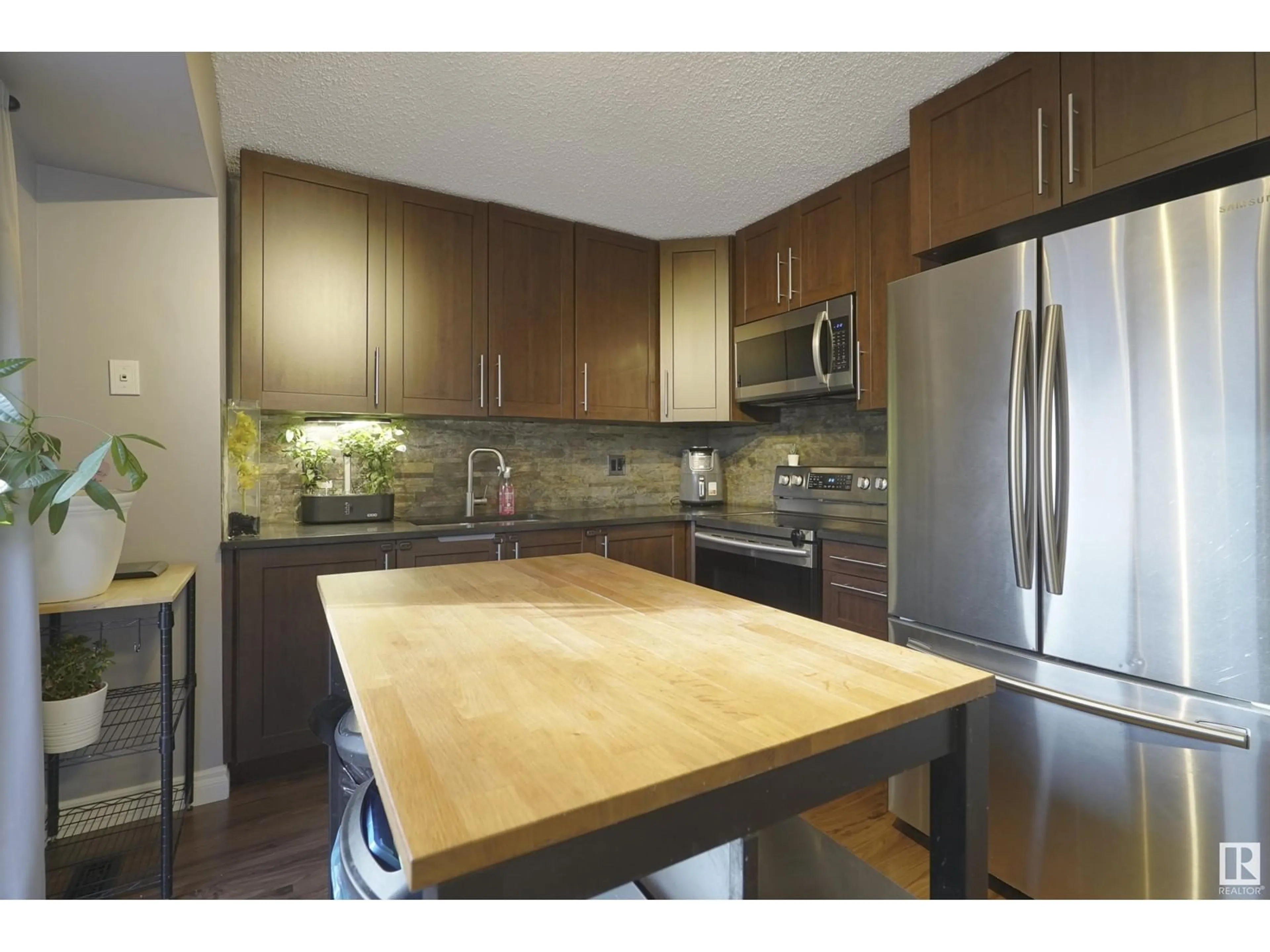 Contemporary kitchen, wood floors for 8703 33 AV NW, Edmonton Alberta T6K2X9