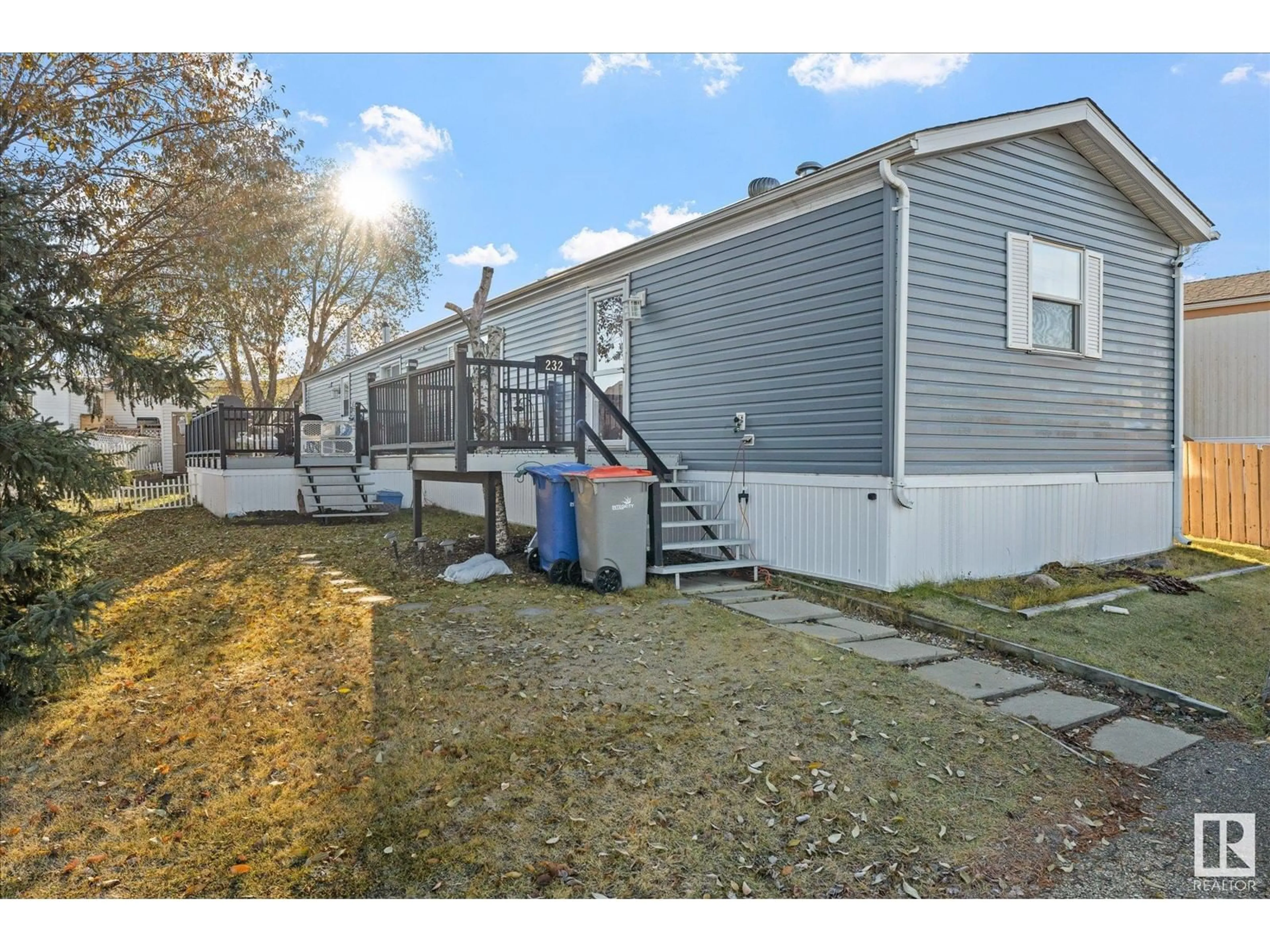 A pic from exterior of the house or condo, the fenced backyard for 232 53222 RR 272, Rural Parkland County Alberta T7X3N8