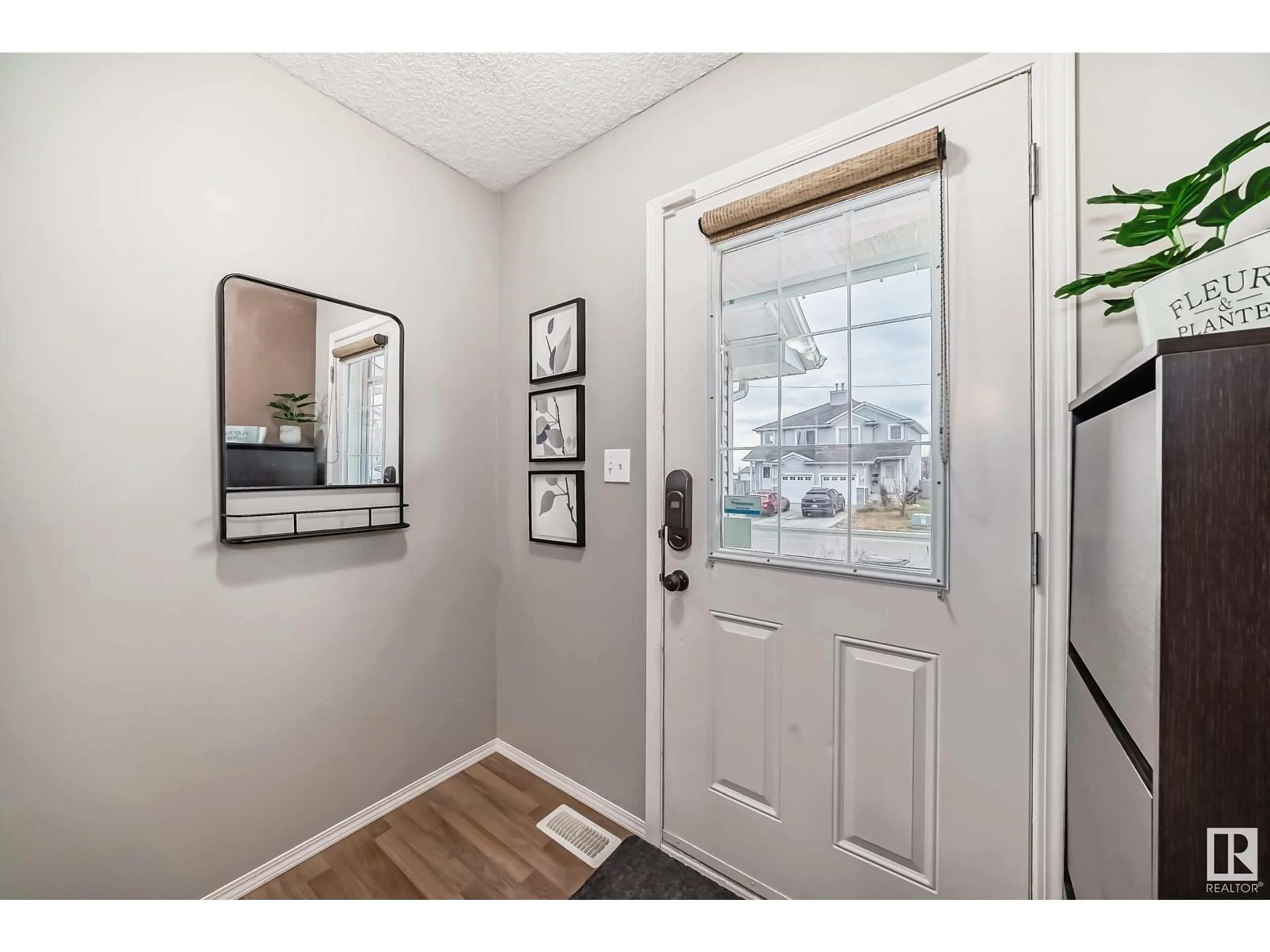 Indoor entryway, wood floors for 16428 56 ST NW, Edmonton Alberta T5Y3M7