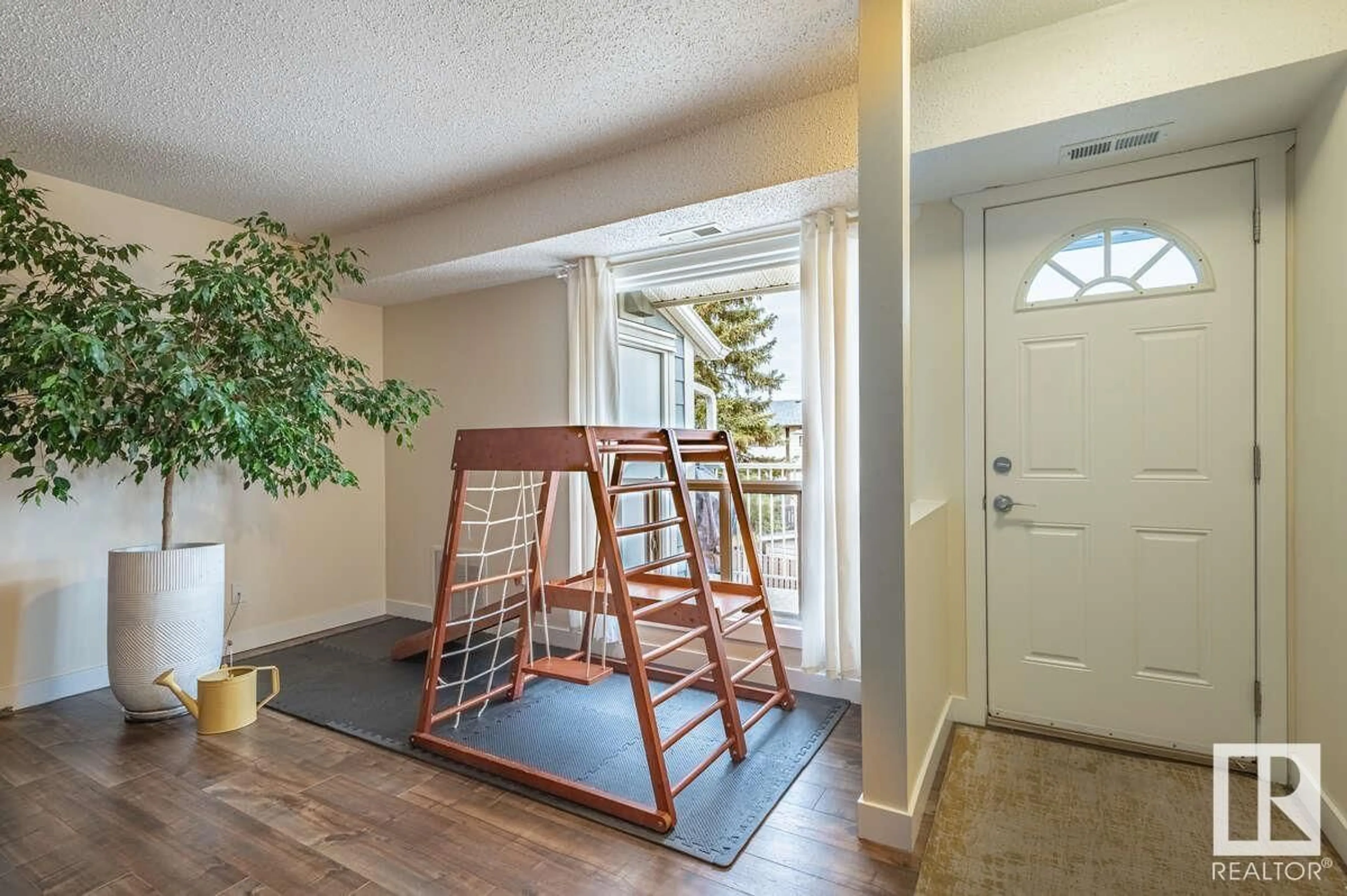 Indoor entryway, wood floors for 2306 151 AV NW, Edmonton Alberta T5Y2L1