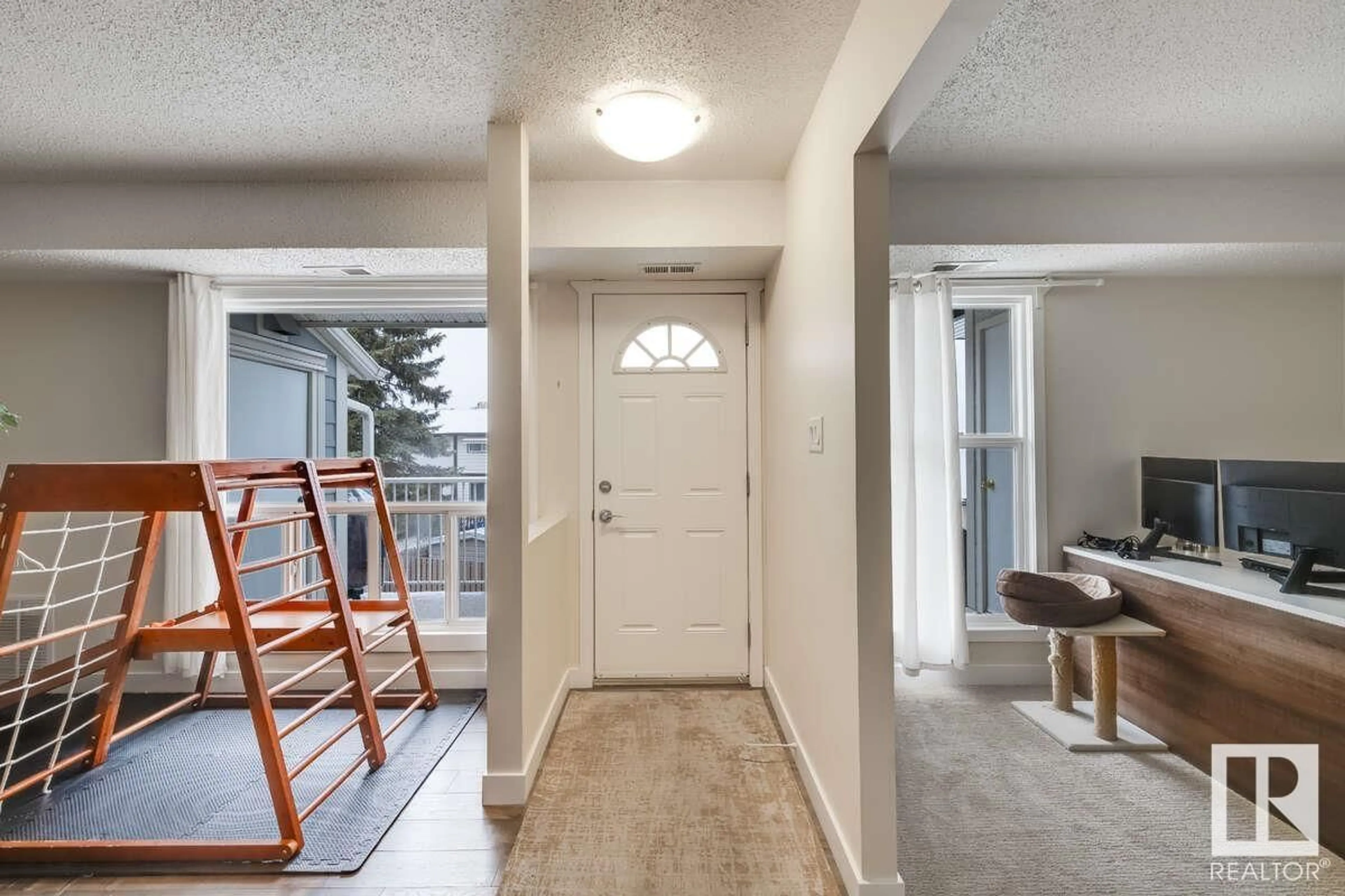 Indoor entryway, wood floors for 2306 151 AV NW, Edmonton Alberta T5Y2L1